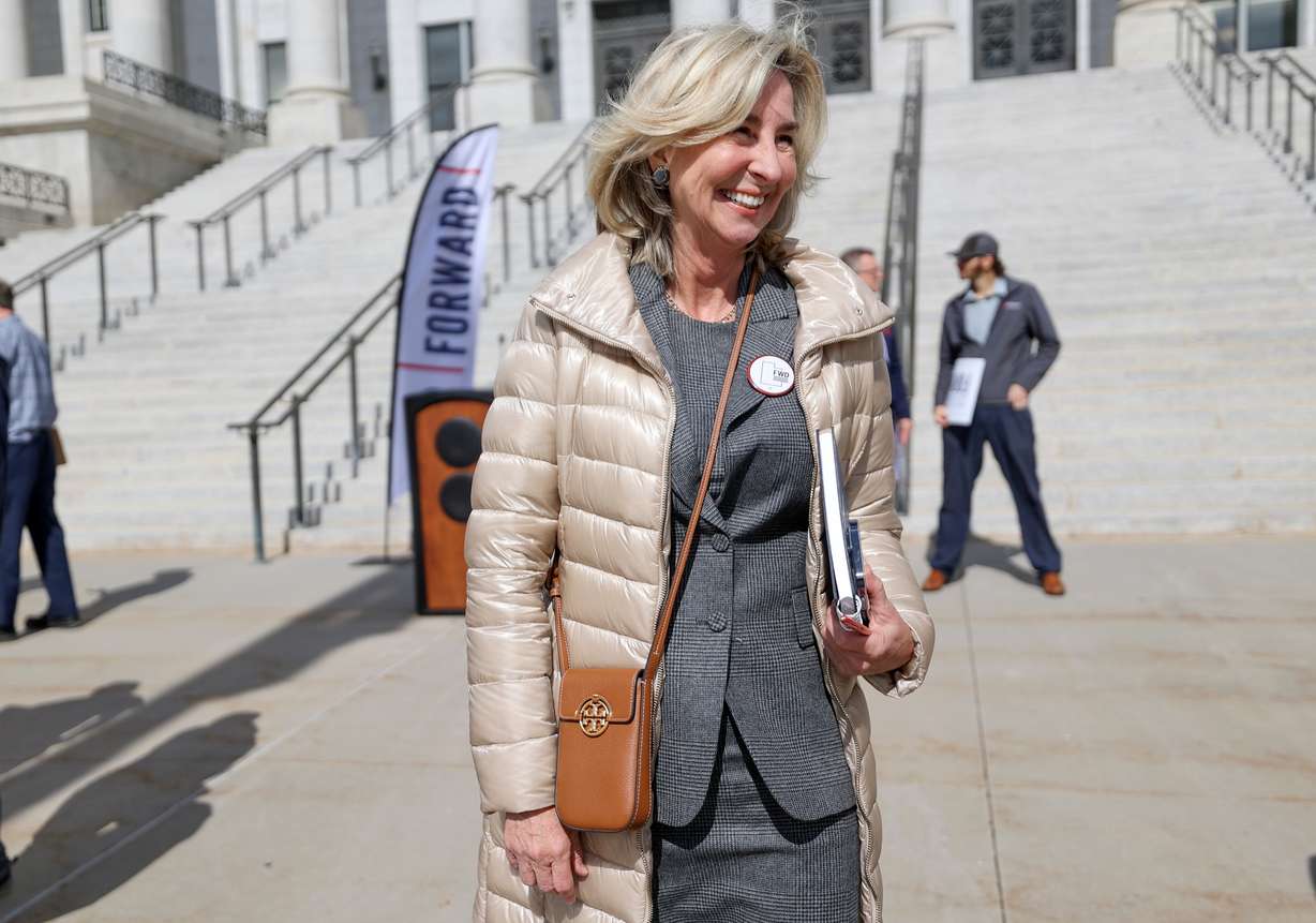 Former Massachusetts Lt. Gov. Kerry Healey, who served under Mitt Romney, chats with press conference attendees after the Utah Forward Party announced their collection of more than 2,000 petition signatures, which is required to put the party on voting ballots, outside of the Capitol in Salt Lake City on Wednesday.