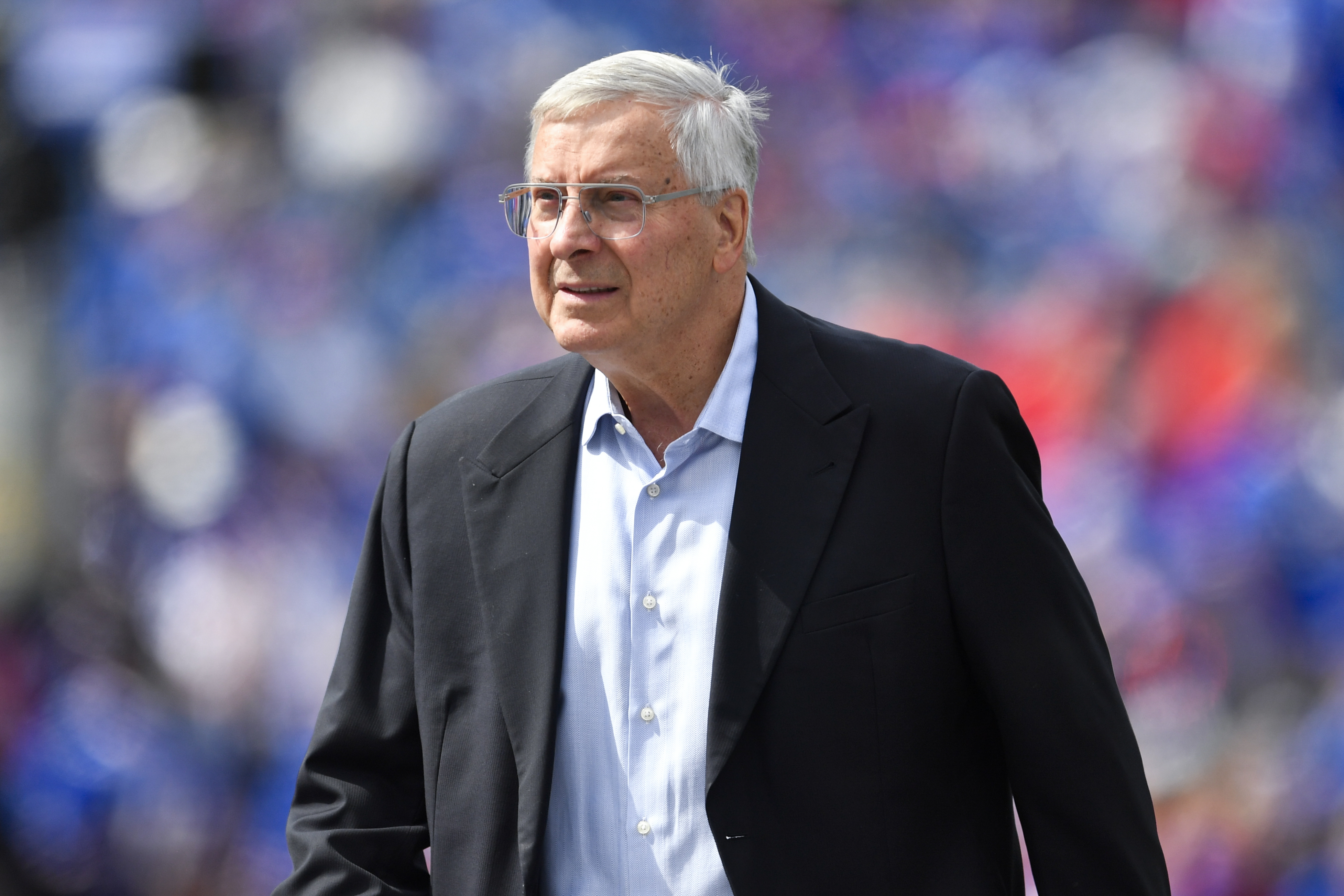 FILE - Buffalo Bills co-owner Terry Pegula walks on the field before the team's NFL football game in Orchard Park, N.Y., Sept. 17, 2023. John Roth, the newly appointed chief operating officer of the Bills and the NHL's Buffalo Sabres, was fired Wednesday along with the Bills' general counsel, Kathryn D’Angelo, because the two were in a romantic relationship, a person briefed on the matter told The Associated Press. Roth had been appointed COO of the Bills in July following a management shakeup involving both teams, which are owned by Terry and Kim Pegula. In a joint telephone interview with The AP, Roth and D'Angelo confirmed they were dismissed without going into detail. 