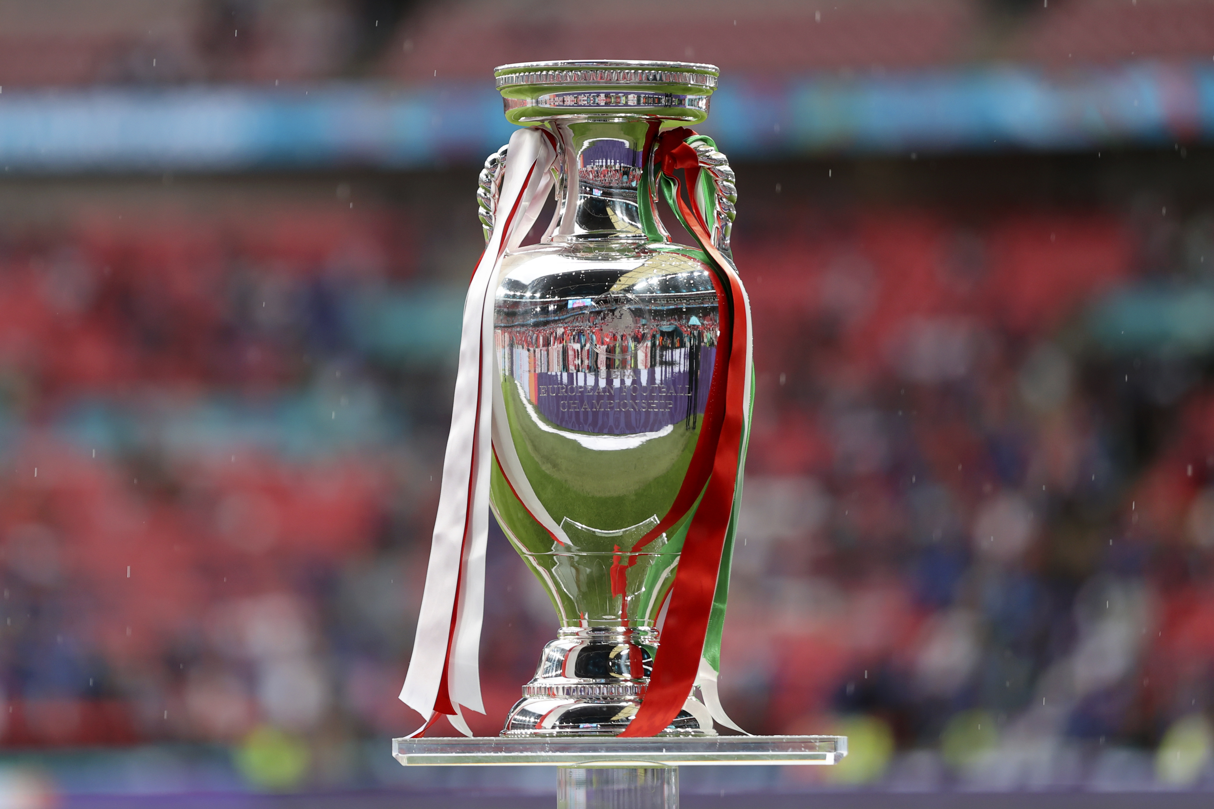 FILE - The trophy is displayed on the pitch before the Euro 2020 soccer championship final match between England and Italy at Wembley stadium in London, Sunday, July 11, 2021. UEFA has decided the future of soccer’s European Championship for the next decade. The United Kingdom and Ireland will host in 2028 and an unusual Italy-Turkey co-hosting plan was picked for 2032.