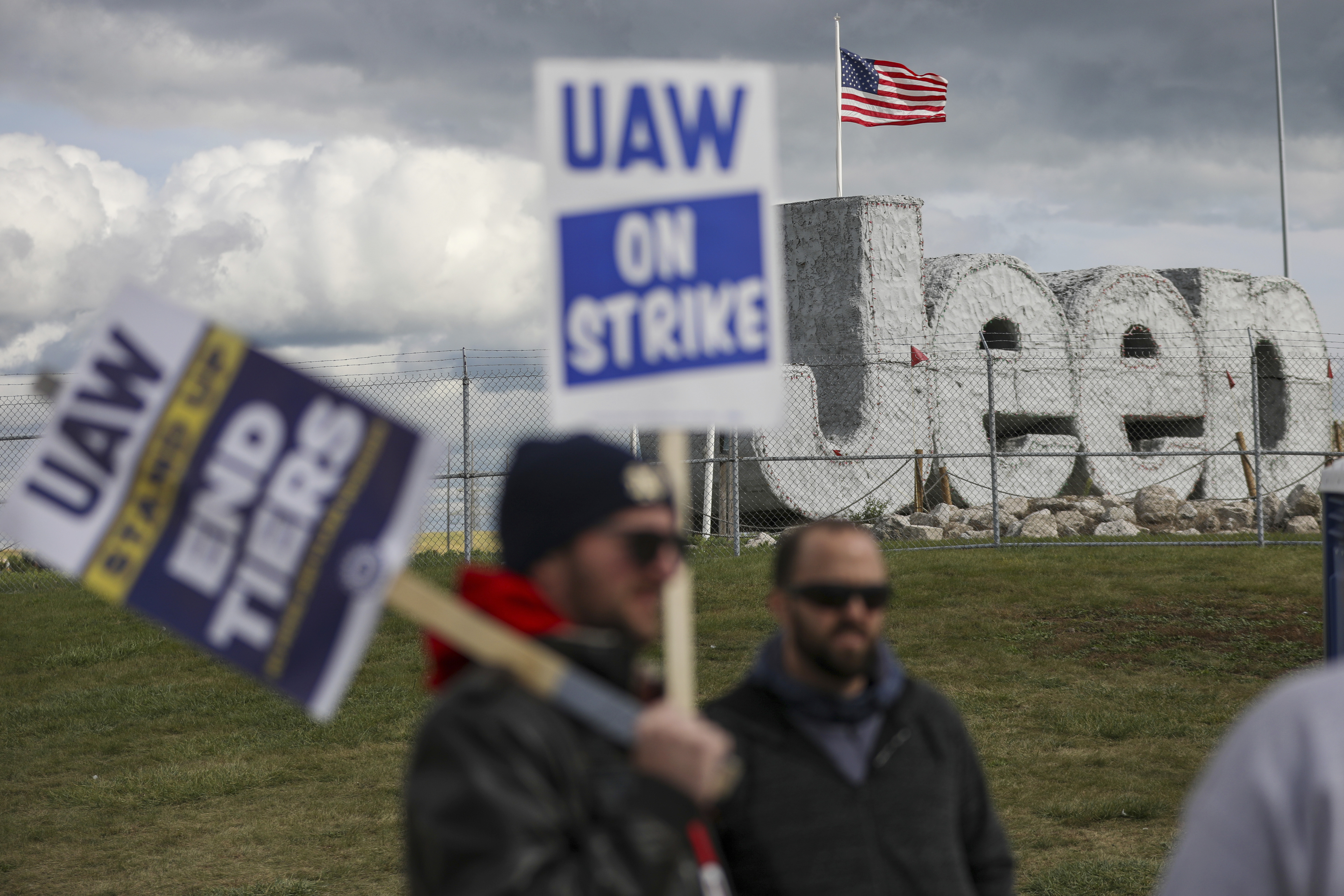 Striking auto workers picket at the Jeep Assembly Plant on Monday in Toledo, Ohio. The autoworkers union contends that the furloughs by Detroit's three automakers were not necessary and are being done in an effort to push members to accept less in contract negotiations. 