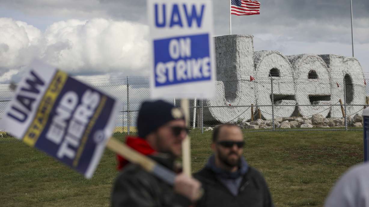 Striking auto workers picket at the Jeep Assembly Plant on Monday in Toledo, Ohio. The autoworkers union contends that the furloughs by Detroit's three automakers were not necessary and are being done in an effort to push members to accept less in contract negotiations.