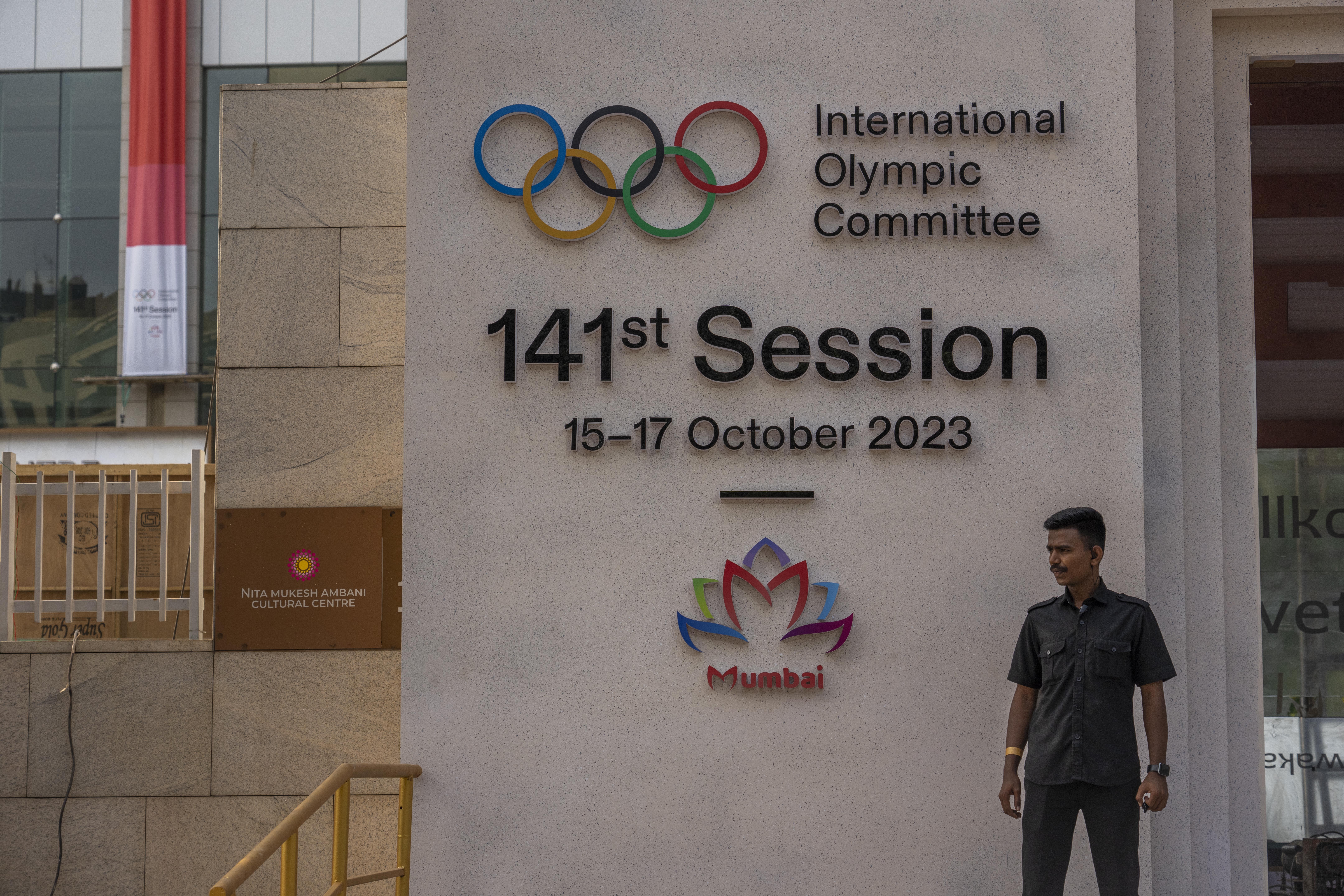 A security guard stands at the entrance of a venue ahead of the upcoming 141st International Olympic Committee (IOC) session in Mumbai, India, Thursday, Oct. 12, 2023.