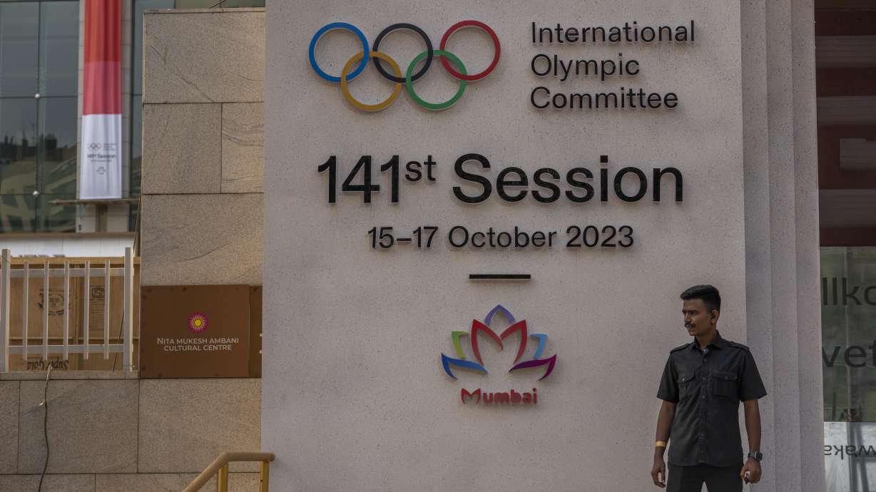 A security guard stands at the entrance of a venue ahead of the upcoming 141st International Olympic Committee (IOC) session in Mumbai, India, Thursday, Oct. 12, 2023.