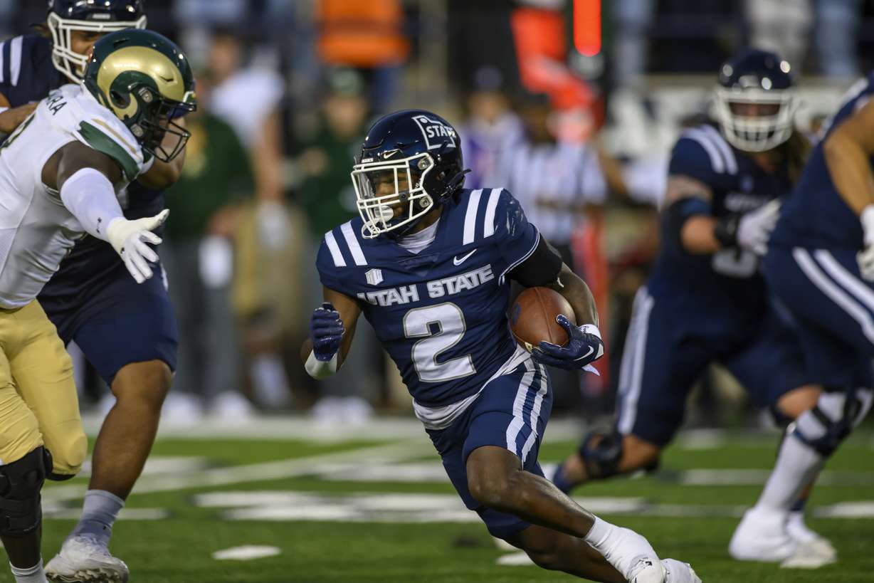Utah State running back Robert Briggs Jr. (2) runs the football during an NCAA football game on Saturday, Oct. 7, 2023 in Logan, Utah.