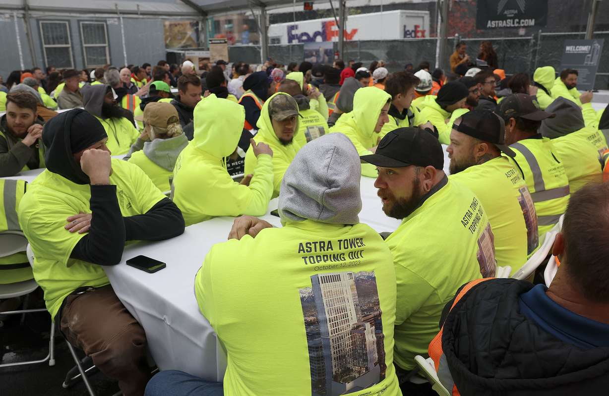 Construction workers attend a beam placement ceremony at Astra Tower in Salt Lake City on Thursday. When finished, the 40-story Astra Tower in the downtown area will be Utah’s tallest high-rise at 450 feet.