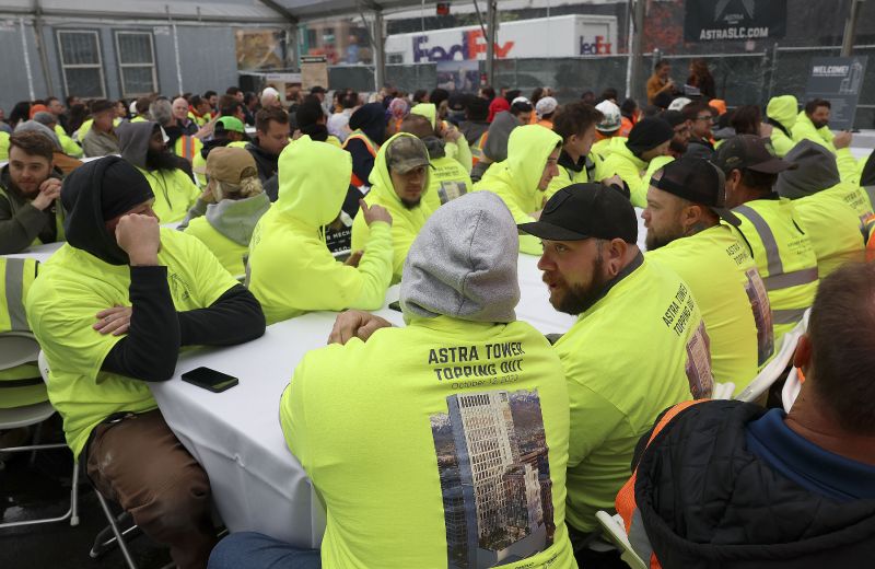 Construction workers attend a beam placement ceremony at Astra Tower in Salt Lake City on Thursday. When finished, the 40-story Astra Tower in Salt Lake City's downtown will be Utah’s tallest high-rise at 450 feet. - Laura Seitz, Deseret News