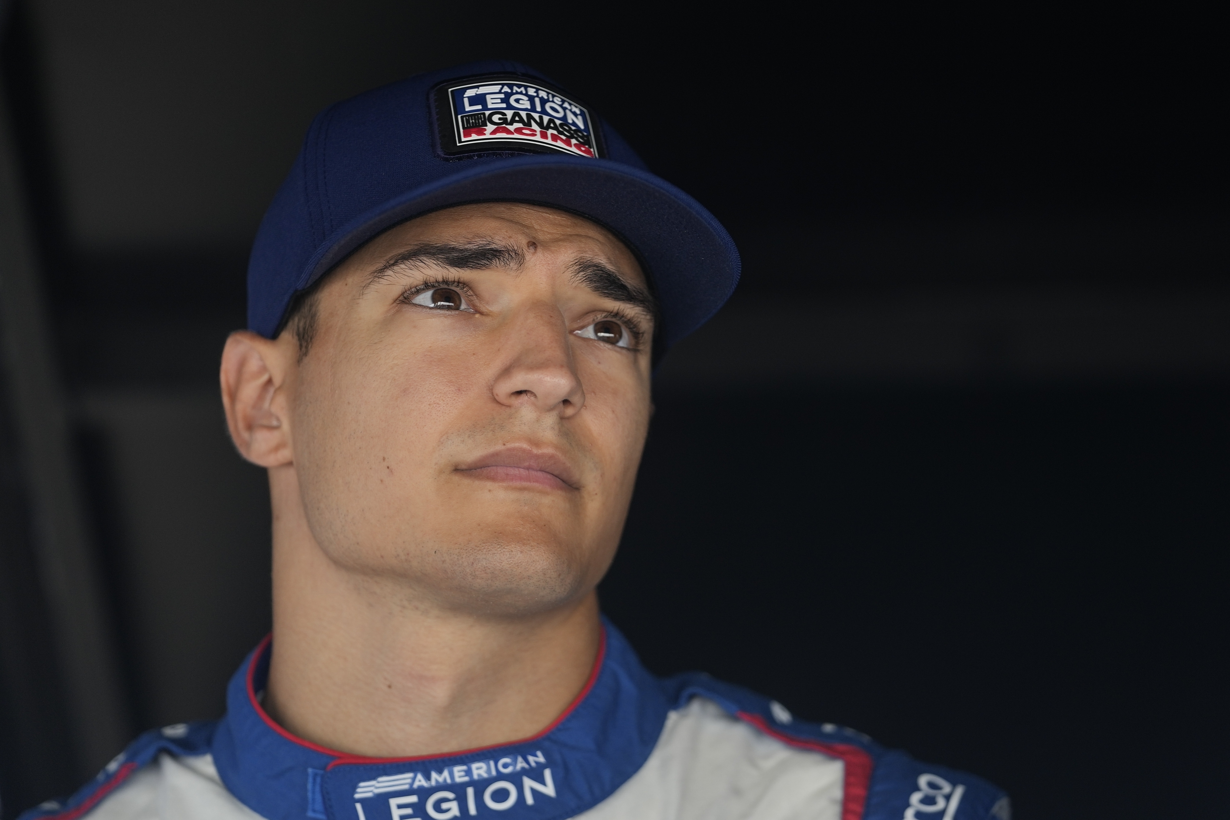 FILE - Alex Palou sits in his pit box during a practice session for the IndyCar Indianapolis GP auto race at Indianapolis Motor Speedway, Friday, Aug. 11, 2023, in Indianapolis. McLaren Racing is suing IndyCar champion Alex Palou for at least $23 million in damages — $400,000 of which is a salary advance paid to the Spaniard — over Palou's decision not to honor the contract he signed to join the team at the end of last month. 