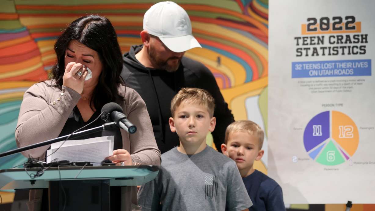 Holly Warren talks about losing her daughter Lilly Warren as a result of an accident at the Kearns Library on Thursday. Warren’s husband Sam Warren and sons Atticus and Johnny Warren stand by.