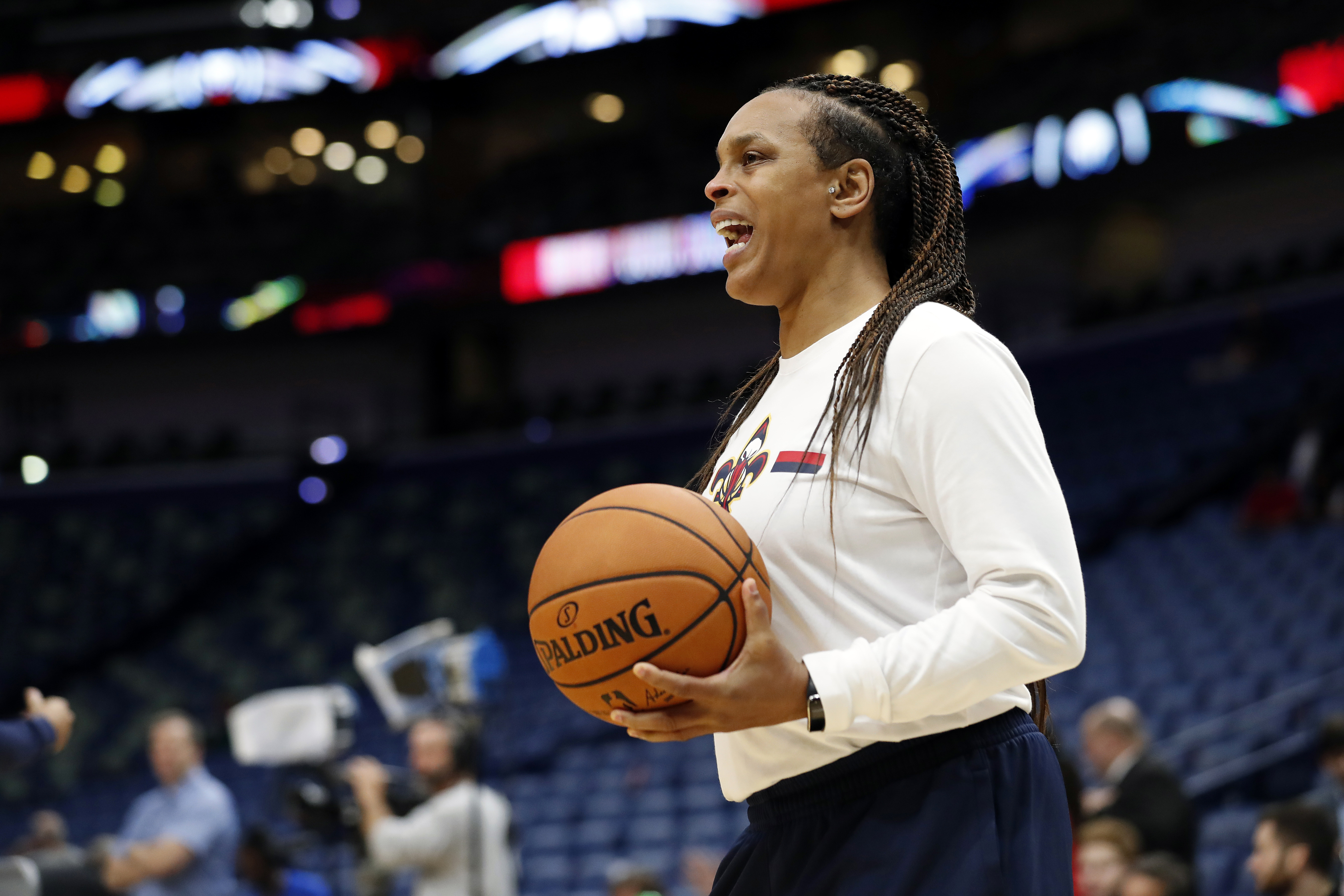 FILE - New Orleans Pelicans player development coach Teresa Weatherspoon stands on the court before the team's preseason NBA basketball game against the Utah Jazz in New Orleans, Oct. 11, 2019. The Chicago Sky have an agreement in place with Weatherspoon to make her their next coach, according to her agent Richard Gray. He confirmed the news in a text message with The Associated Press on Tuesday night, Oct. 10, 2023. 