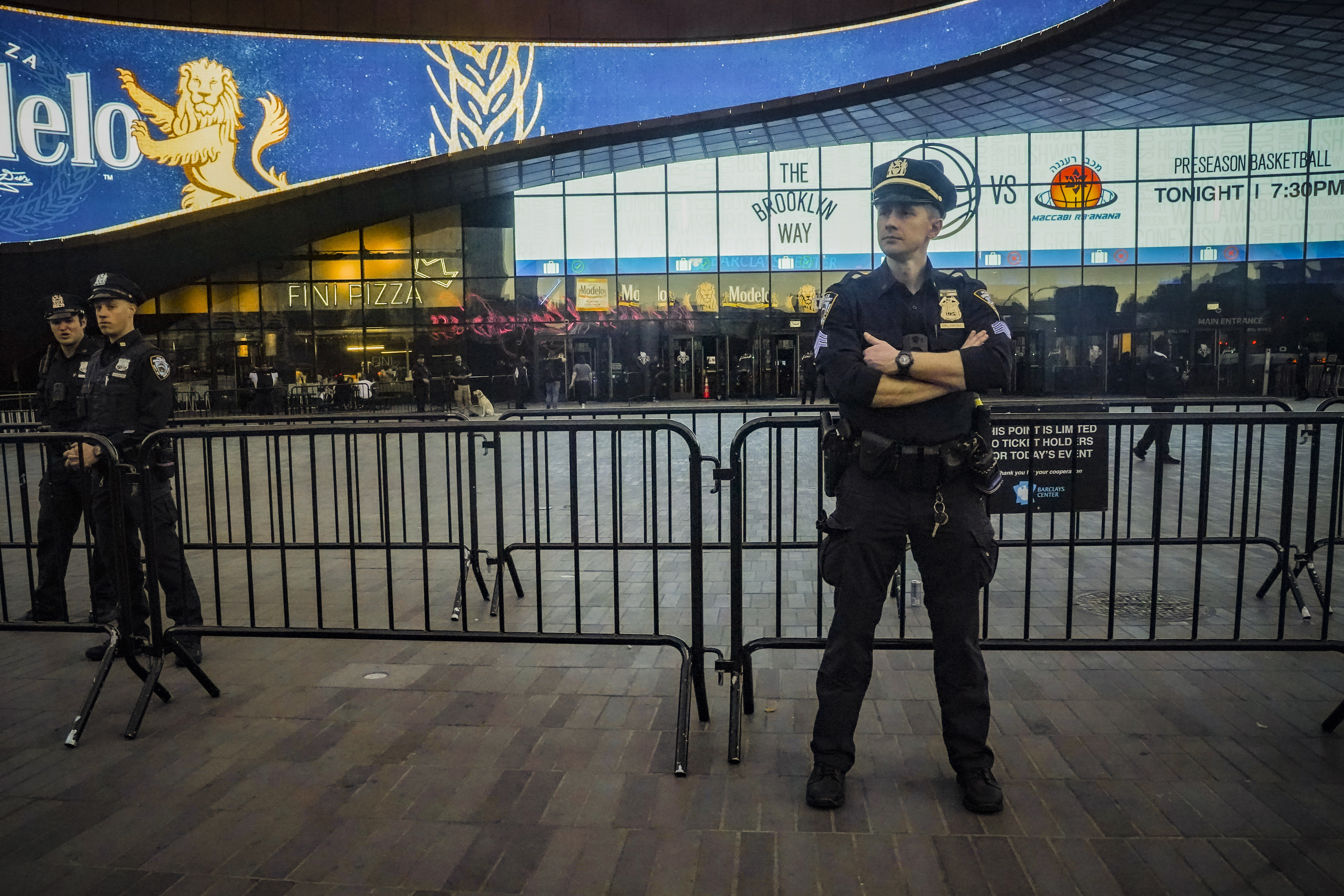 Police officers increase their presence at Barclays arena for a preseason NBA basketball game between the Brooklyn Nets and Israel's Maccabi Ra'anana, Thursday, Oct. 12, 2023, in New York. 