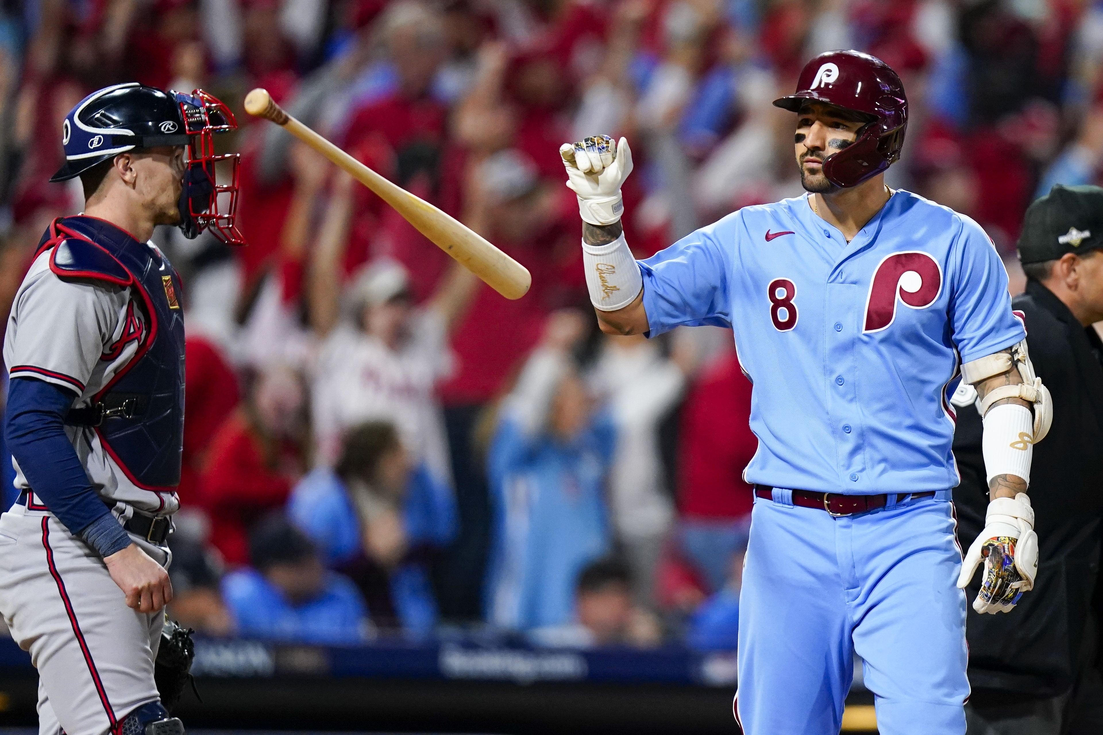 Philadelphia Phillies' Nick Castellanos flips his bat after hitting a home run during the sixth inning of Game 4 of a baseball NL Division Series against the Atlanta Braves Thursday, Oct. 12, 2023, in Philadelphia.