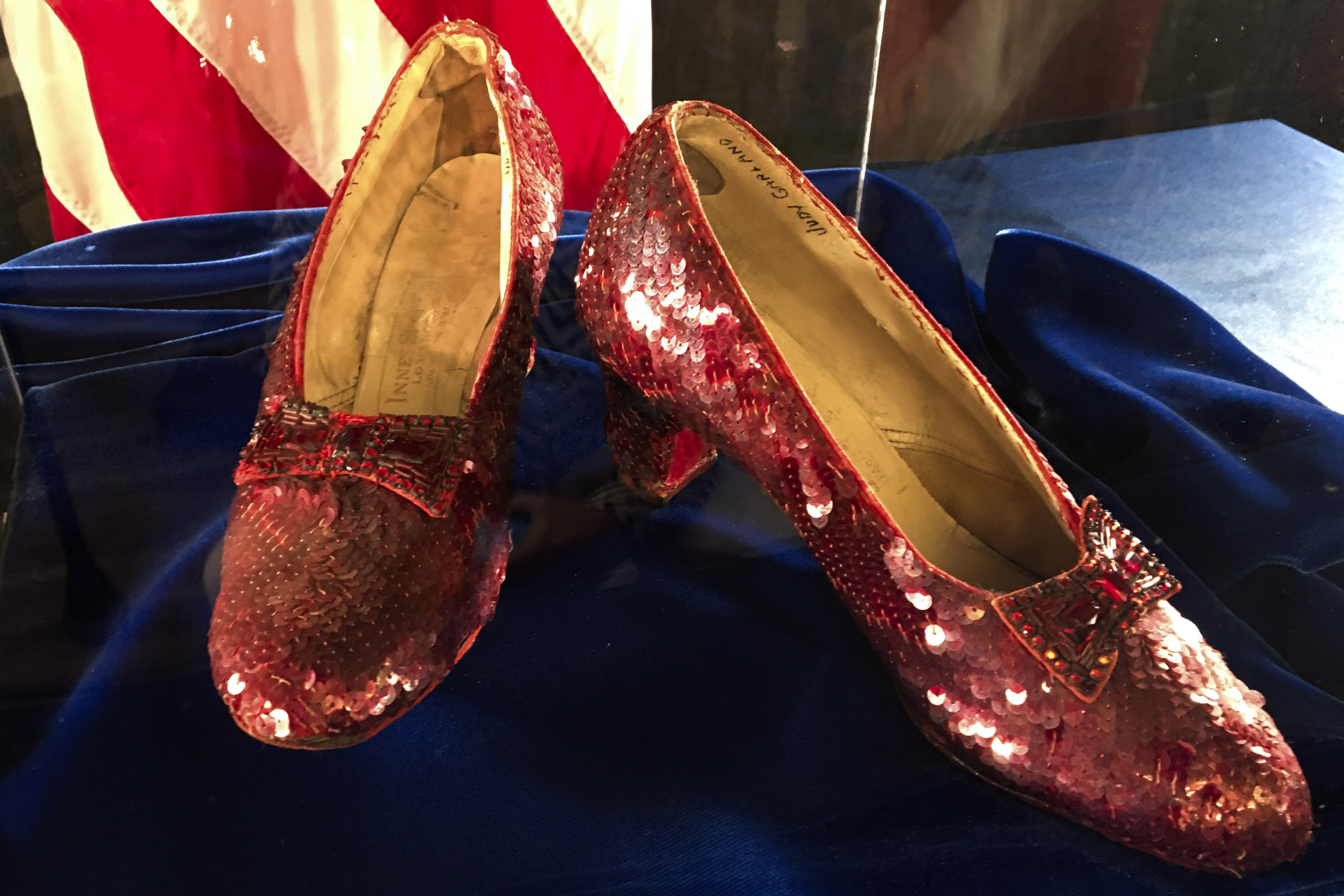 A pair of ruby slippers once worn by actress Judy Garland in the "The Wizard of Oz" sit on display Sept. 4, 2018, at the FBI office in Brooklyn Center, Minn. A man pleaded guilty Friday to stealing them in a museum heist. 