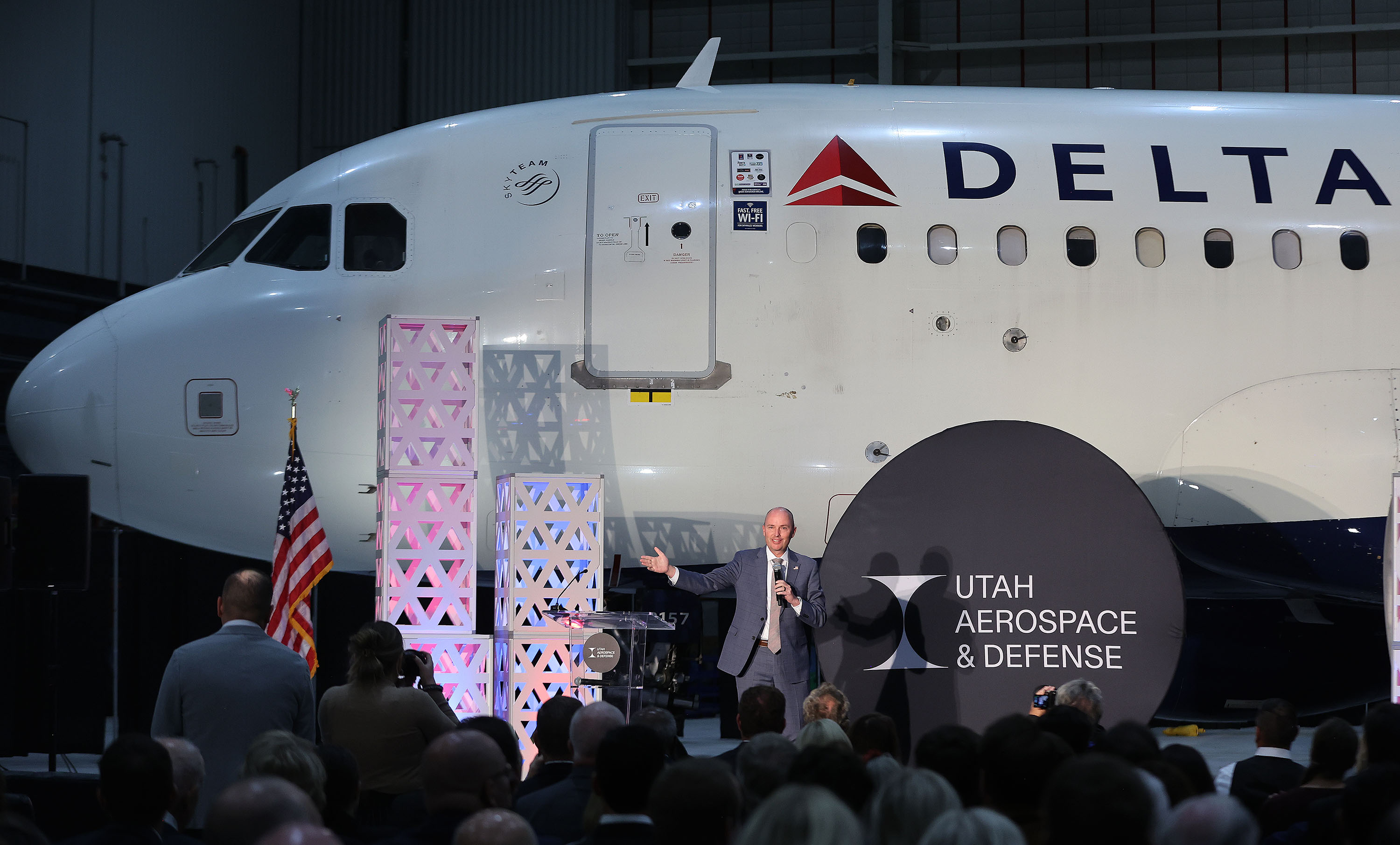 Gov. Spencer Cox speaks at the Delta hangar in Salt Lake City on Thursday, Oct. 12, 2023 as Utah Aerospace and Defense invests in artificial intelligence and semiconductor research and rebrands.