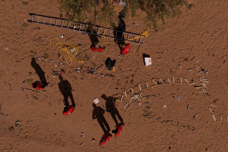 Stairs used by migrants to cross into the United States from Mexico sit in the desert near the border as members of Mexican immigrant welfare agency Grupo Beta patrol outside Ciudad Juarez, Mexico, Sept. 15.
