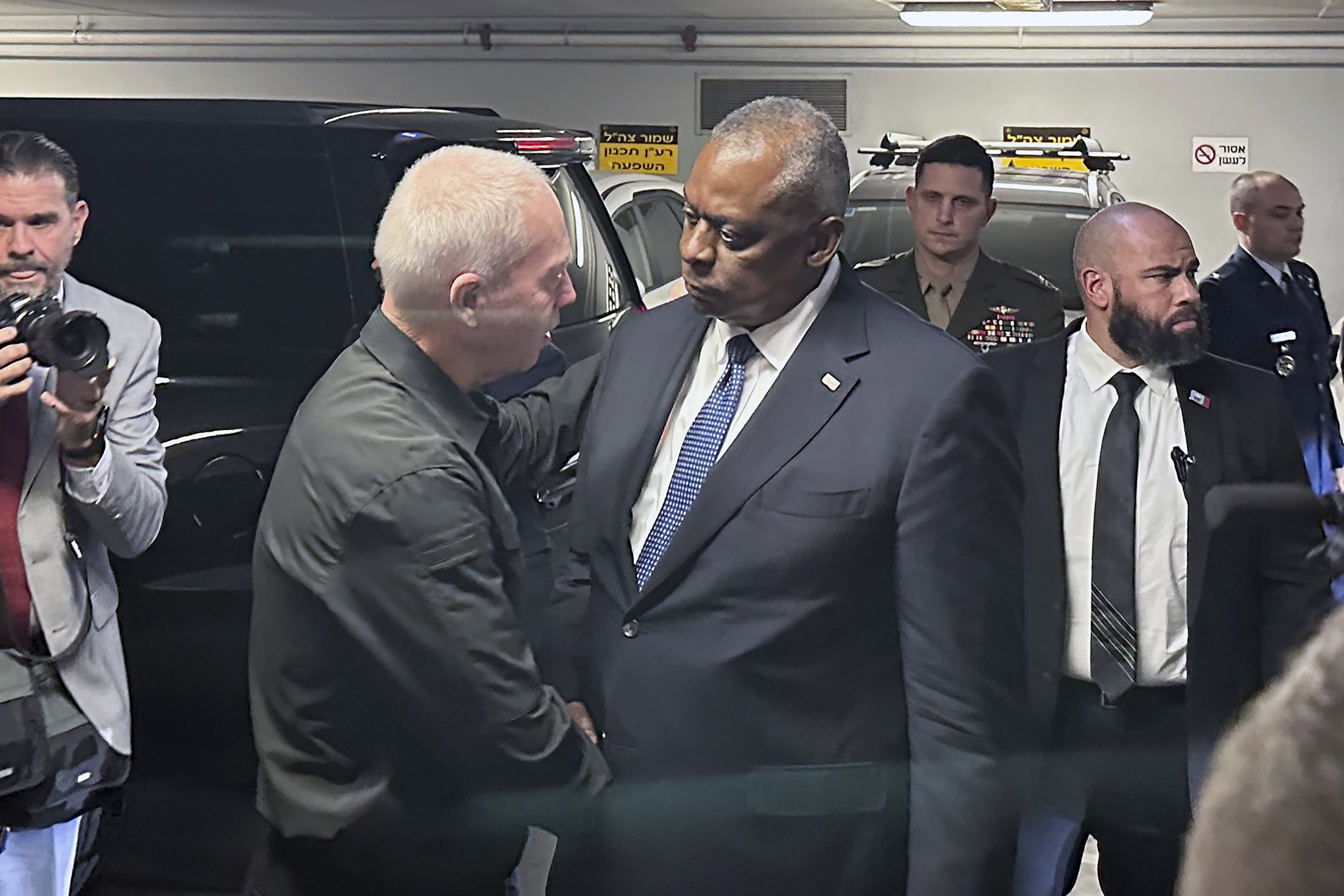U.S. Defense Secretary Lloyd Austin, right, is greeted by Israel’s Minister of Defense Yoav Gallant as he arrives at the Ministry of Defense, Friday, in Tel Aviv. Austin is in Israel for meetings with senior government leaders and to see firsthand some of the U.S. weapons and security assistance that Washington rapidly delivered to Israel in the first week of its war with the militant Hamas group.