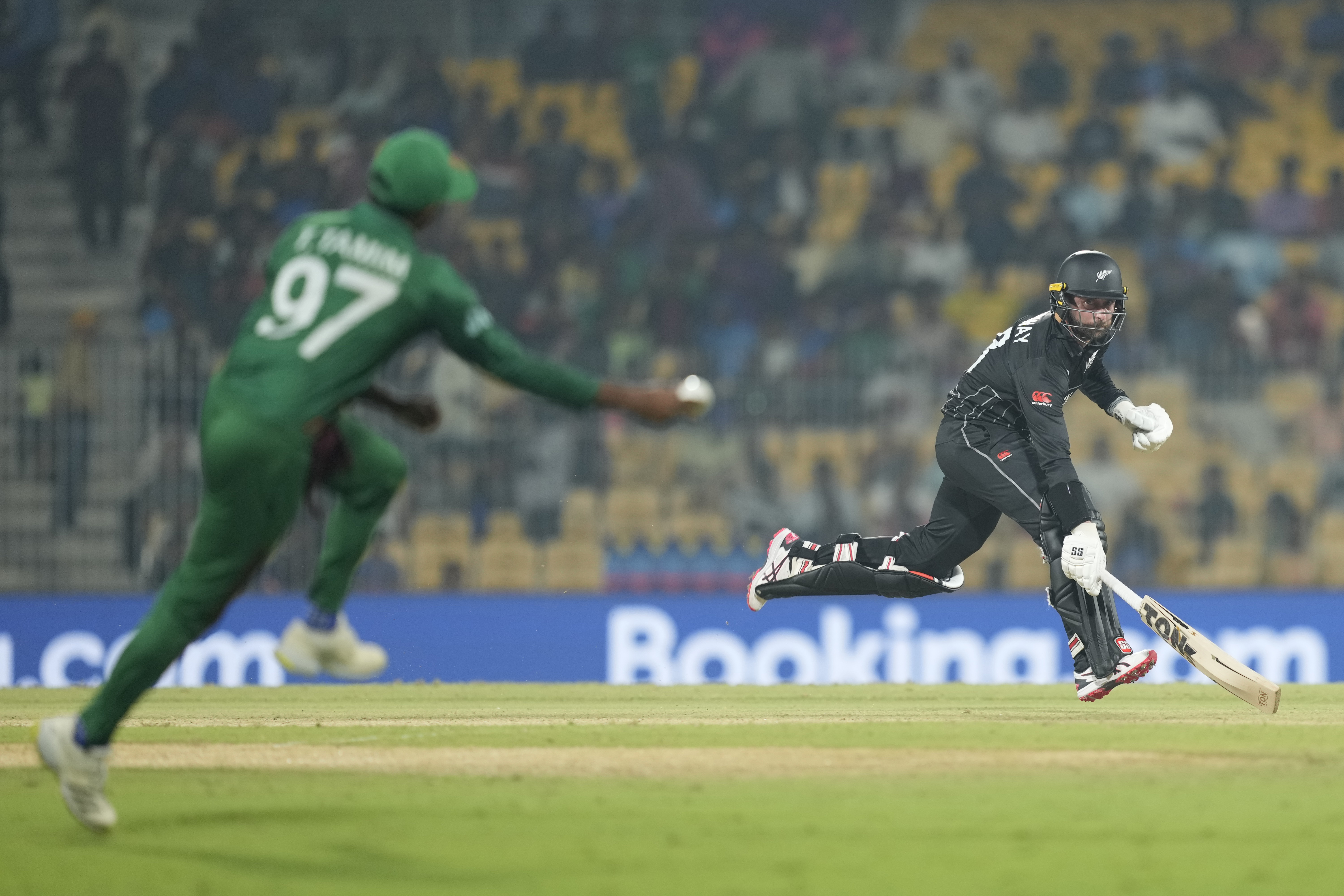 New Zealand's Devon Conway run between the wickets during the ICC Men's Cricket World Cup match between New Zealand and Bangladesh in Chennai , India, Friday, Oct. 13, 2023.