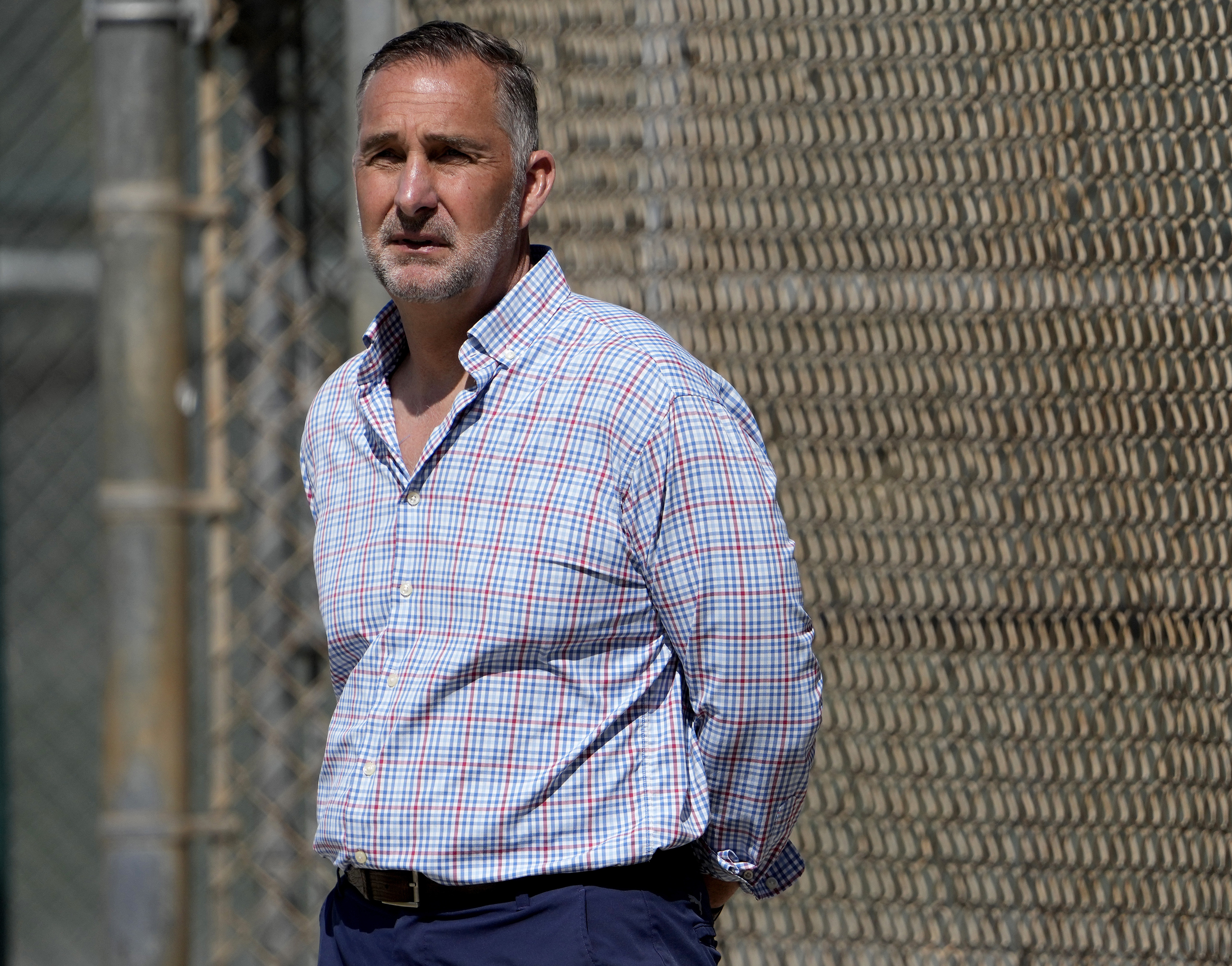 FILE - St. Louis Cardinals president of baseball operations John Mozeliak watches spring training baseball practice Feb. 15, 2023, in Jupiter, Fla. Authorities are seeking at least five people in an armed robbery of the Cardinals complex in the Dominican Republic, Friday, Oct. 13, 2023. A Dominican Republic police spokesman told The Associated Press that the suspects bound and gagged a security guard and stole watches, rings, necklaces and other items from athletes and personnel.