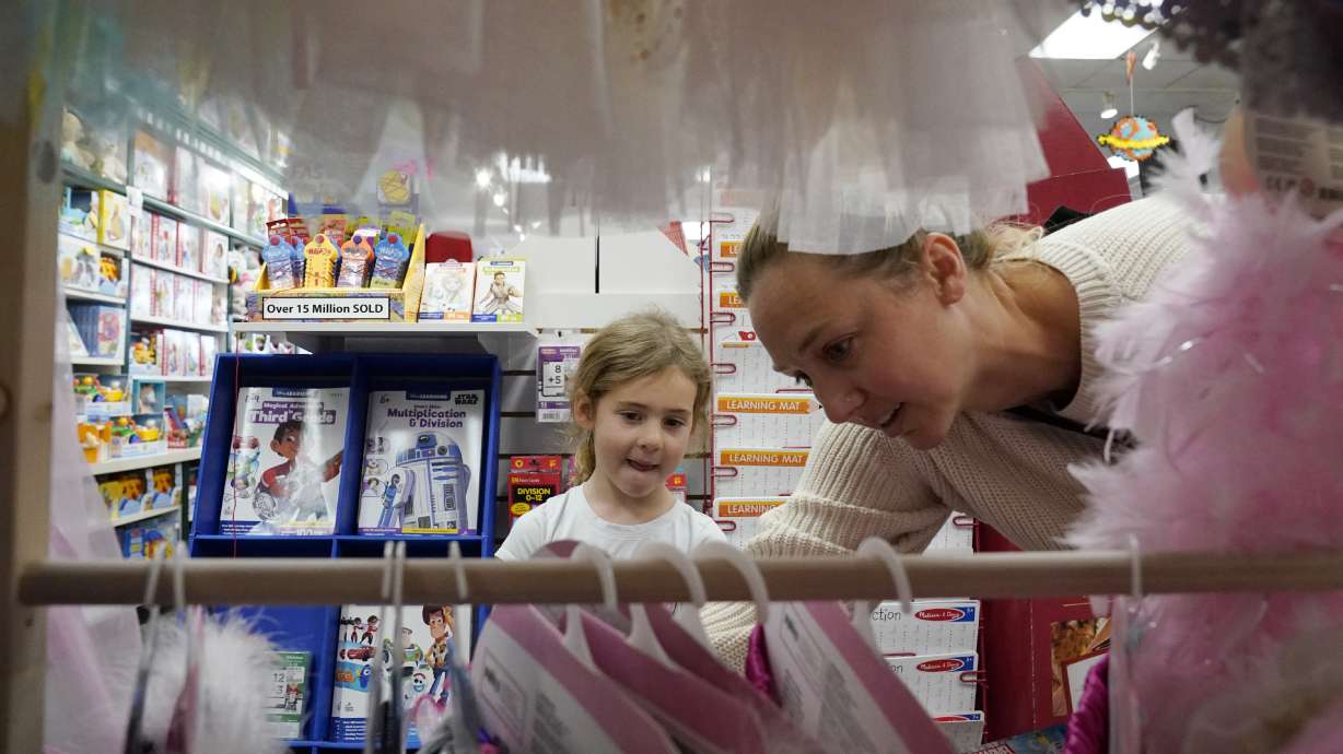 Quinn Byrne, 5 left, shops with her mother, Jamie Byrne, at a Learning Express store in Lake Zurich, Ill., Sept. 26. A growing number of toy marketers are embracing new designation of toys that teach kids skills like how to adjust to new challenges.