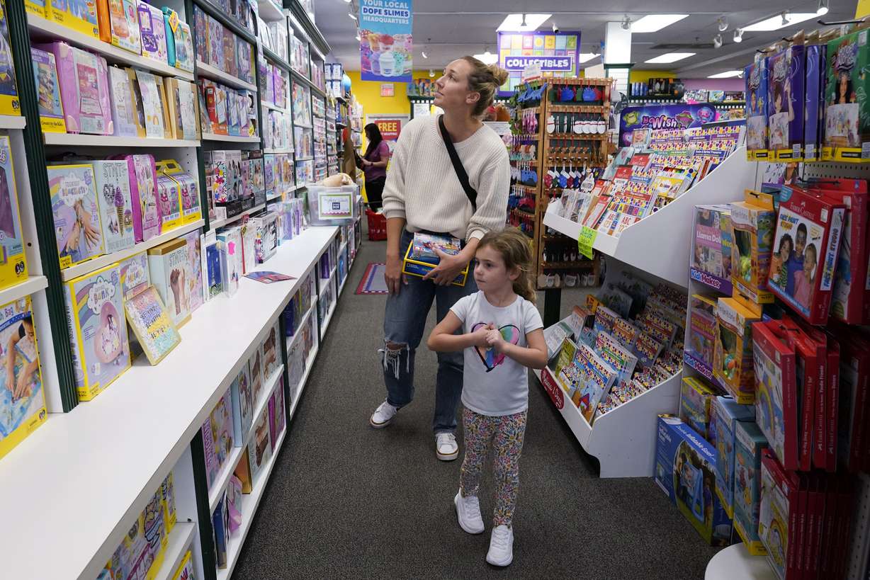 Quinn Byrne, 5 front, shops with her mother, Jamie Byrne, at a Learning Express store in Lake Zurich, Ill., Tuesday, Sept. 26. While still in its early phase, a growing number of toy marketers are embracing MESH — or mental, emotional and social health — as a designation for toys that teach kids skills like how to adjust to new challenges, resolve conflict, advocate for themselves, or solve problems.