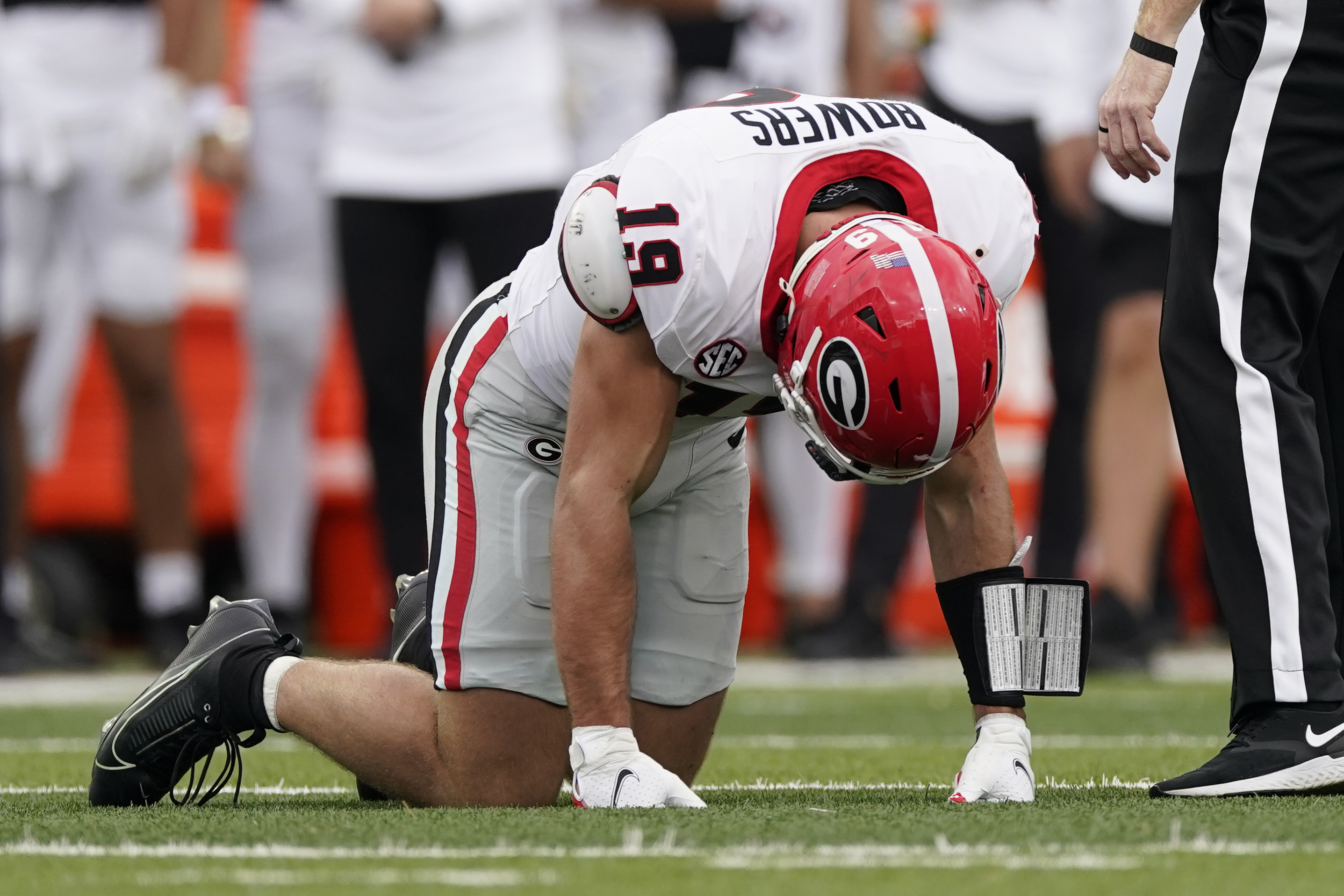Georgia tight end Brock Bowers kneels on the turf after being injured in the first half of an NCAA college football game against Vanderbilt, Saturday, Oct. 14, 2023, in Nashville, Tenn. 