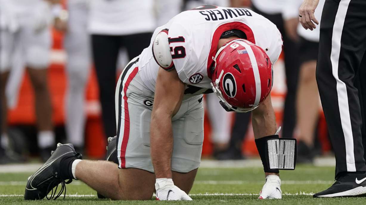 Georgia tight end Brock Bowers kneels on the turf after being injured in the first half of an NCAA college football game against Vanderbilt, Saturday, Oct. 14, 2023, in Nashville, Tenn.