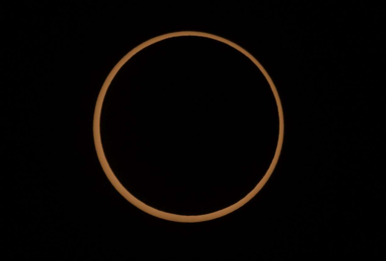 An annular solar eclipse is pictured in Torrey, Wayne County, on Saturday. A phenomenon known as the "ring of fire" is visible because of the way the sun's edges surround the moon perfectly.