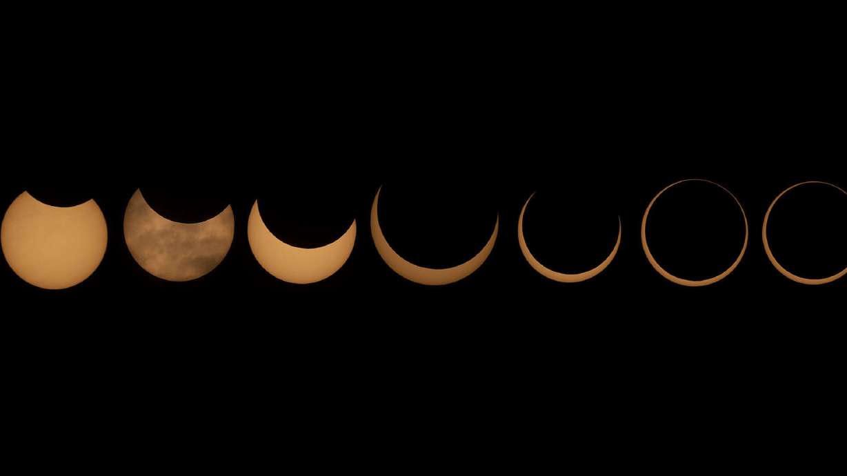 This is a composite image of different phases of the annular solar eclipse that was visible in Torrey, Wayne County, on Saturday. A phenomenon known as the "ring of fire" is visible because of the way the sun's edges surround the moon perfectly.
