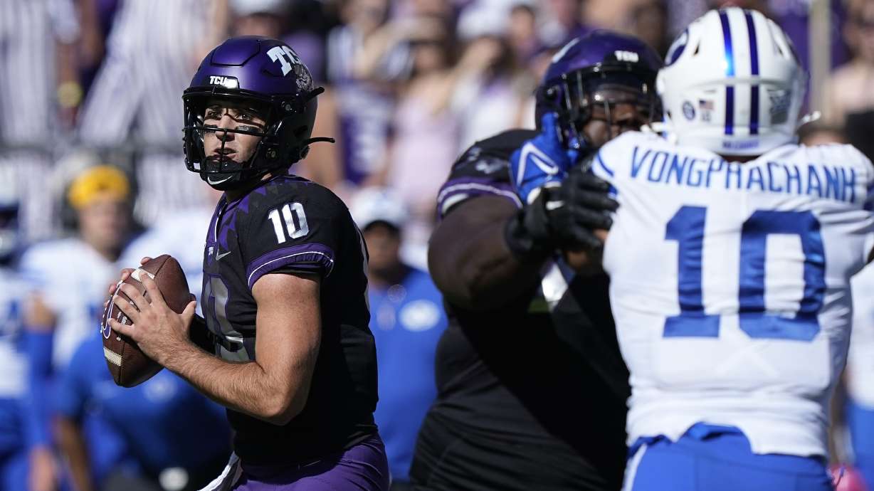 TCU quarterback Josh Hoover (10) looks to pass with blocking against BYU linebacker AJ Vongphachanh (10) during the first half of an NCAA college football game Saturday, Oct. 14, 2023, in Fort Worth, Texas.