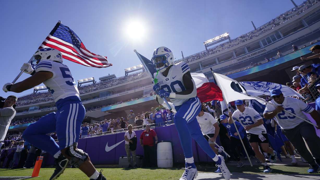 BYU runs onto the field before an NCAA college football game against TCU, Saturday, Oct. 14, 2023, in Fort Worth, Texas.