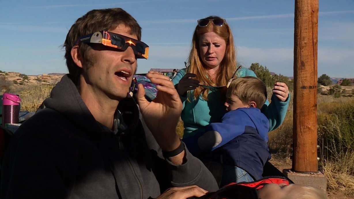 The Hopkins family gets ready to view the eclipse Saturday at Canyonlands National Park.