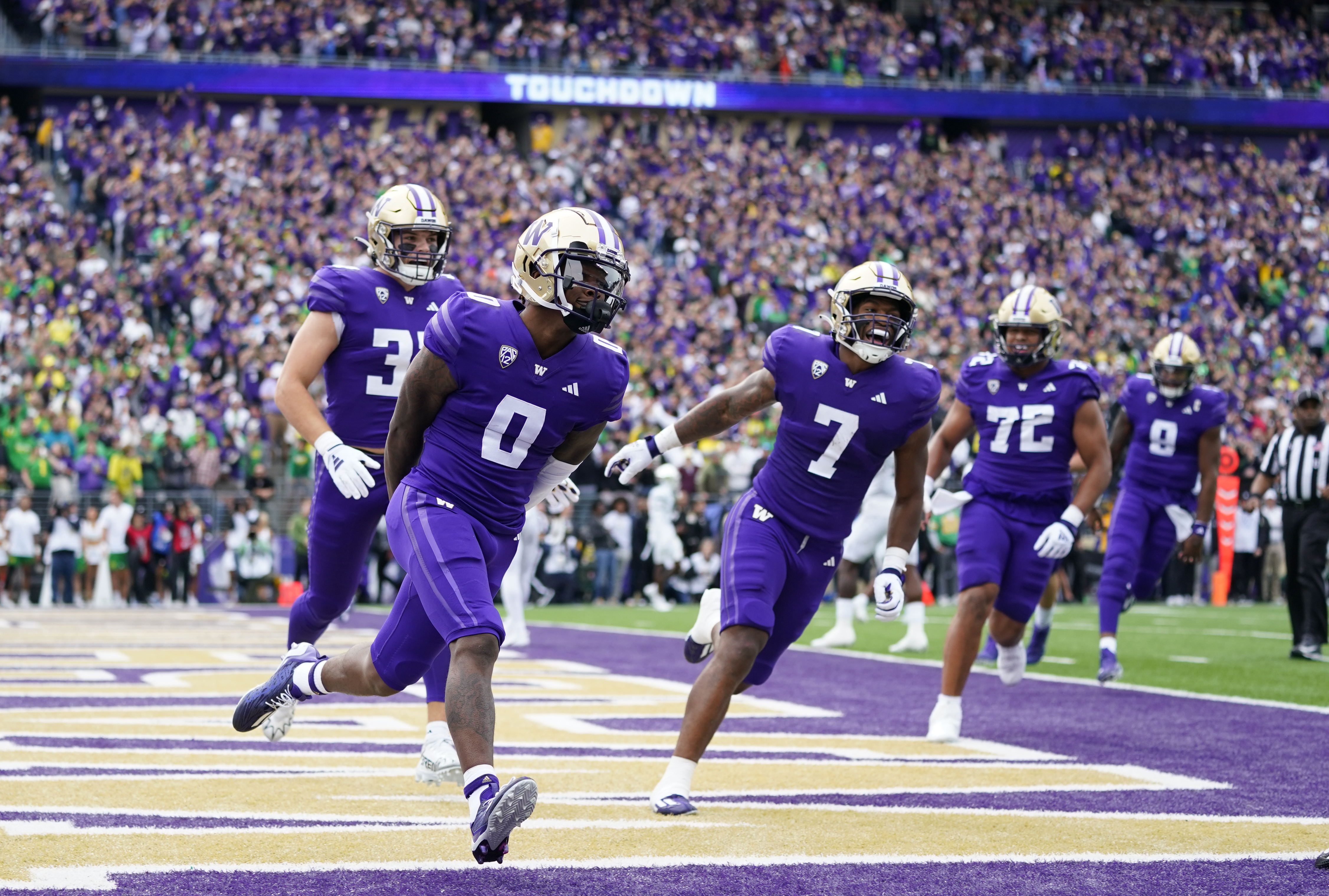 Washington wide receiver Giles Jackson (0) celebrates after scouring a touchdown against Oregon during the first half of an NCAA college football game, Saturday, Oct. 14, 2023, in Seattle.