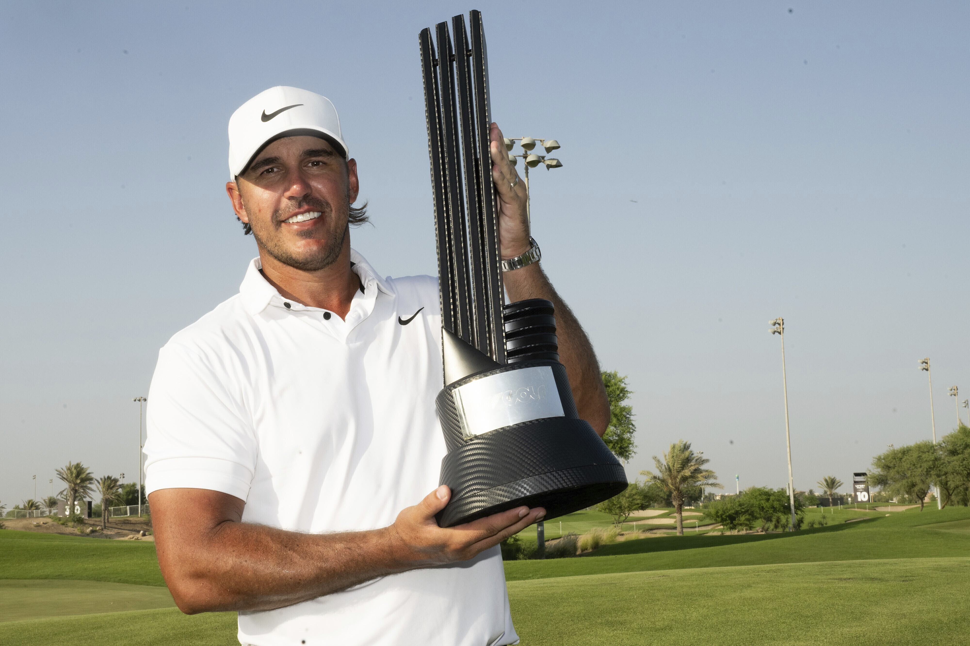 First Place Individual Champion Captain Brooks Koepka, of Smash GC, celebrates with the trophy after winning the LIV Golf Jeddah tournament at the Royal Greens Golf & Country Club on Sunday, Oct. 15, 2023 in King Abdullah Economic City, Saudi Arabia.