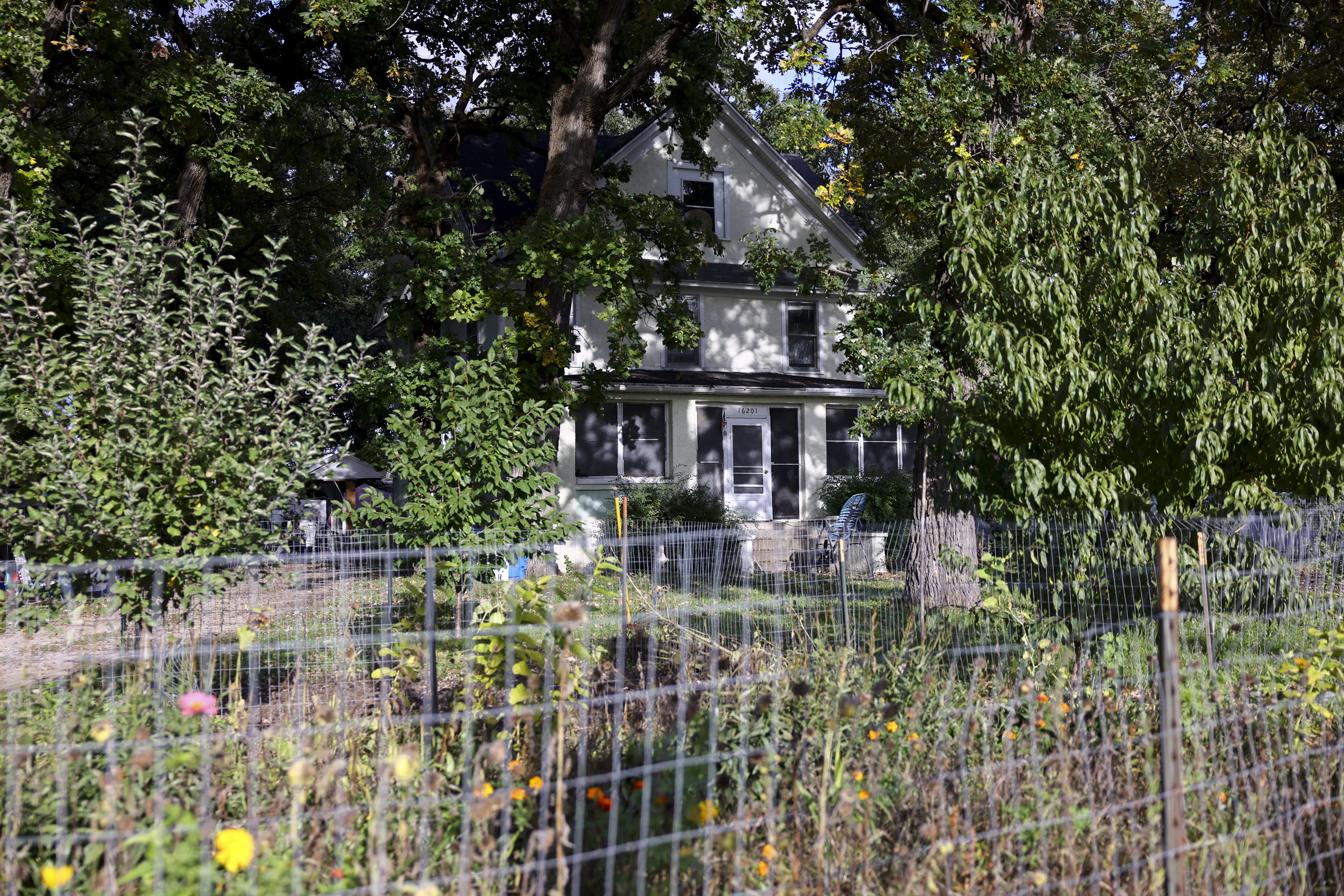This is the home where a boy was killed and a woman critically injured after police say they were stabbed by a man who targeted them because they were Muslim is shown in Plainfield, Ill., Sunday. 