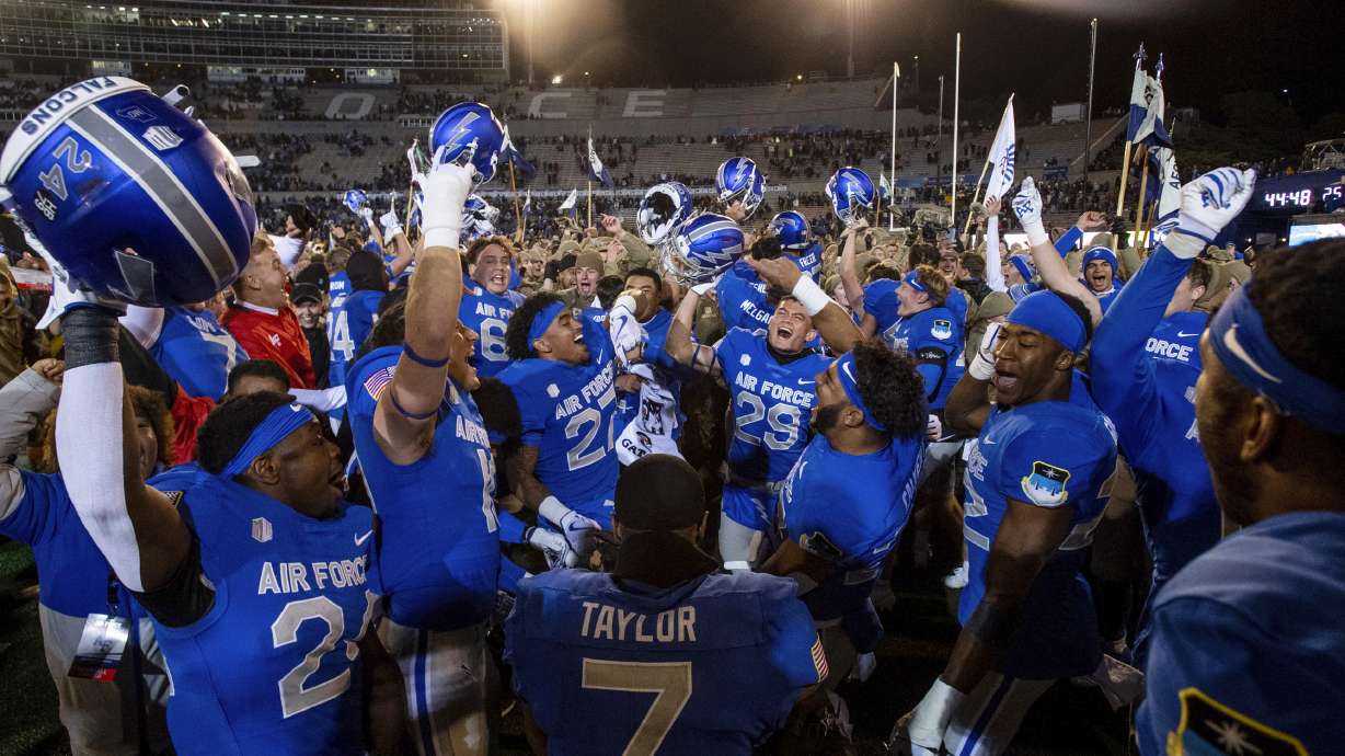Air Force celebrates a win over Wyoming in an NCAA college football game Saturday, Oct. 14, 2023, at Air Force Academy, Colo.