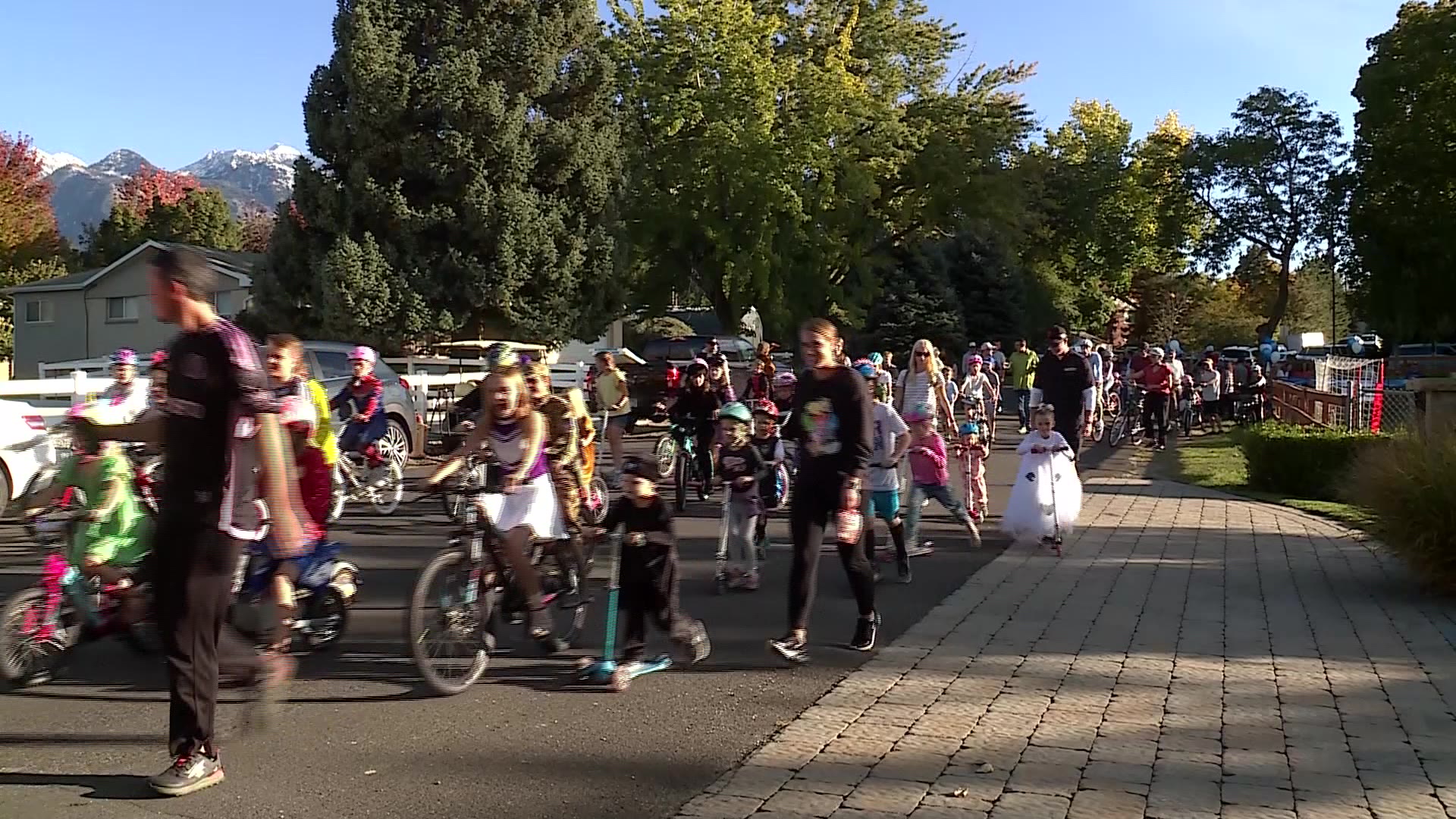 The Cottonwood Heights community rides along with Caroline Chubbuck in a parade on Saturday.