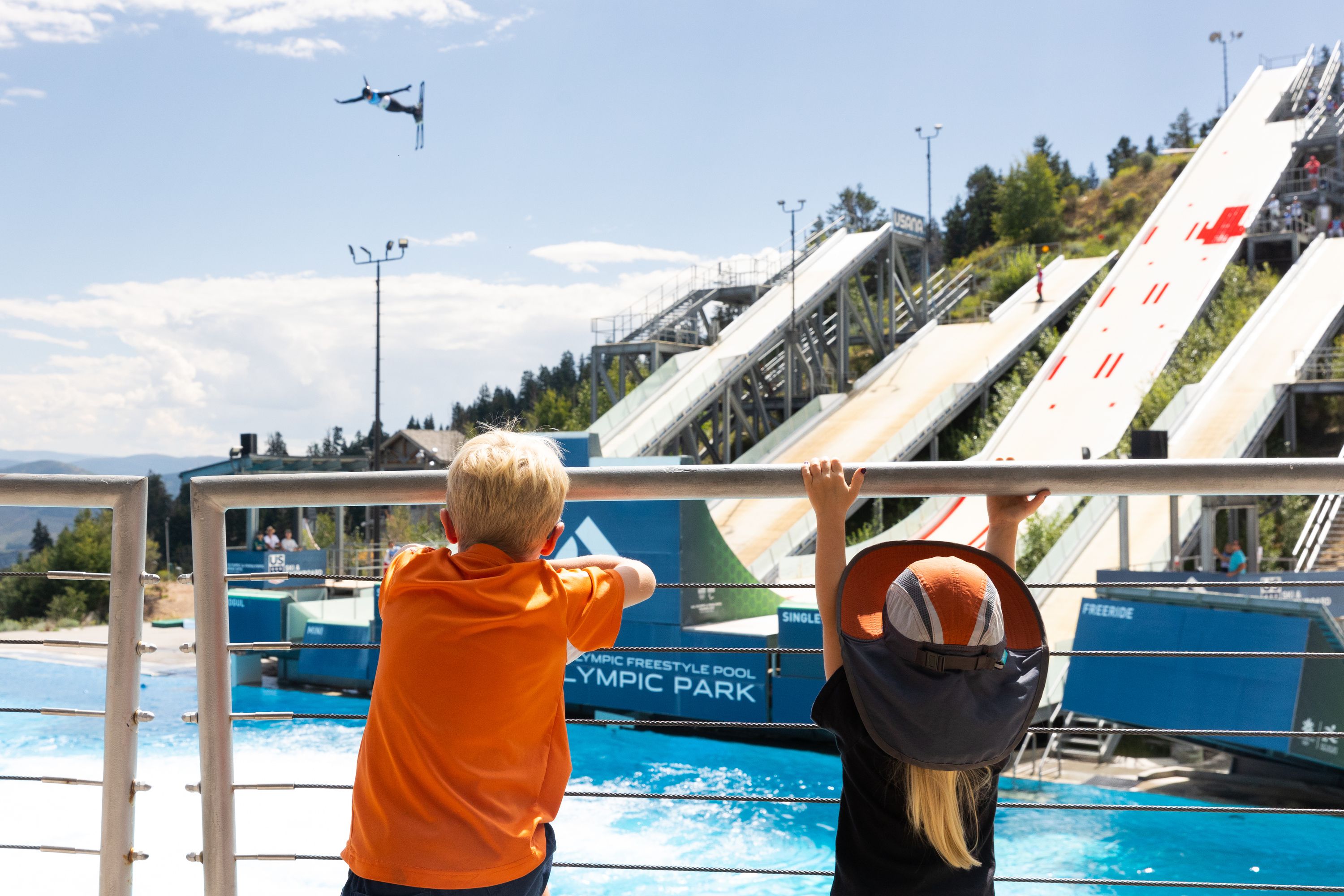 Wyatt, left, and Victoria watch athletes compete at the 2023 U.S. Freestyle Ultimate Airwave Competition at the Utah Olympic Park in Park City on Aug. 26. Will the 2030 and 2034 Winter Games be awarded at the same time?