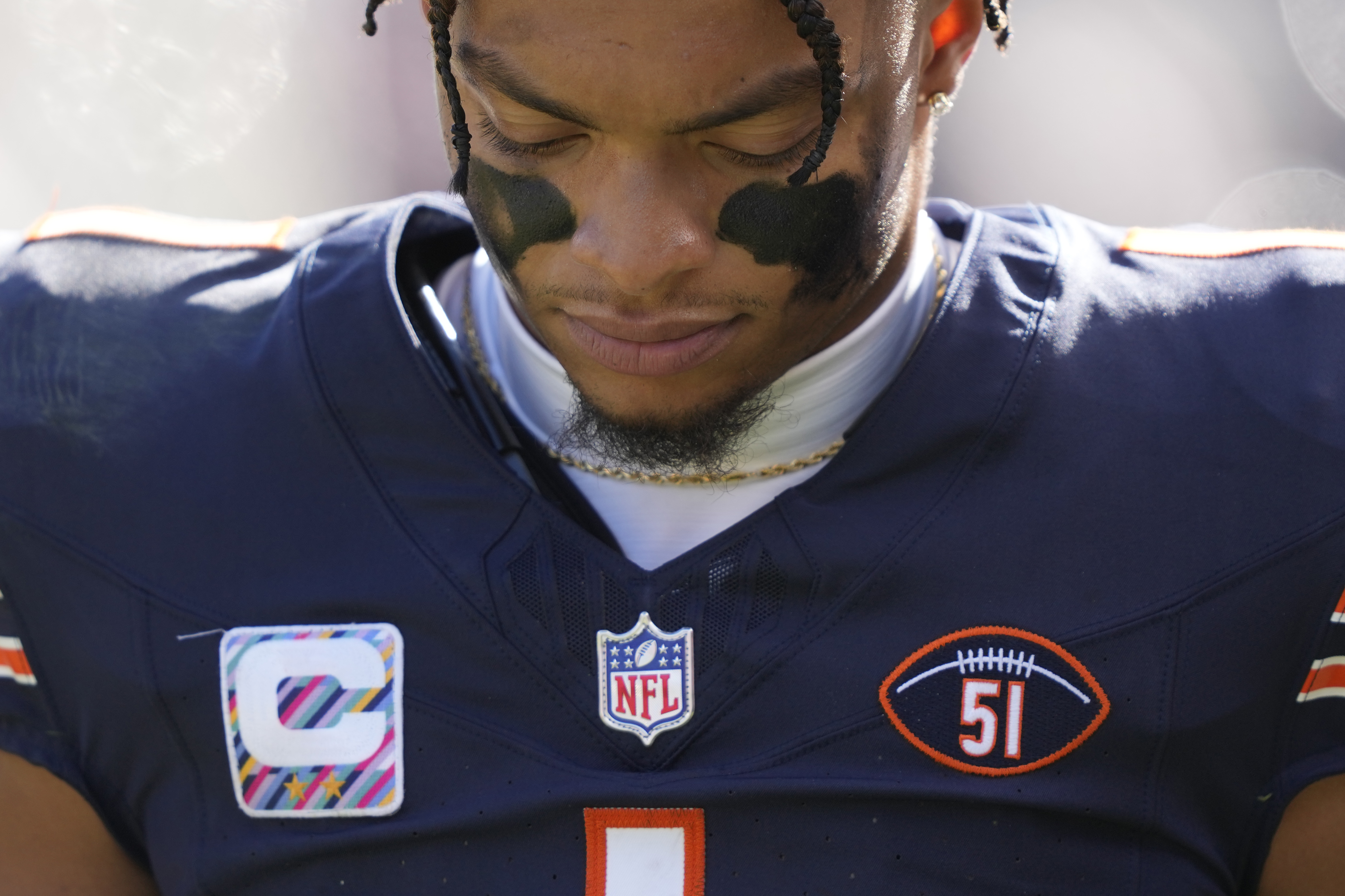 Chicago Bears quarterback Justin Fields walks to the locker room injured during the second half of an NFL football game against the Minnesota Vikings, Sunday, Oct. 15, 2023, in Chicago. On Field's jersey is the football and No. 51 patch honoring Dick Butkus. Fields never returned to the game.
