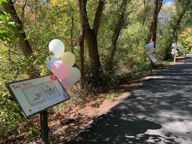 Signs along Tale Trail in Murray Park. There are 17 signs along the trail with two book pages in each stand.