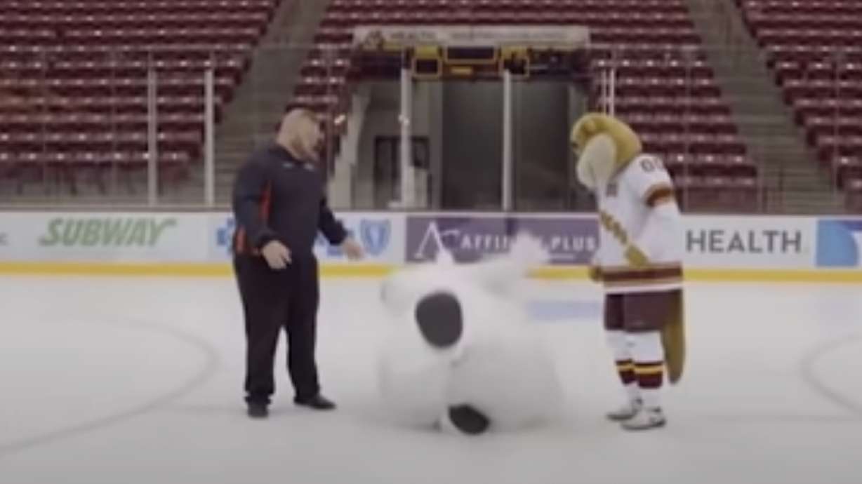 A bear mascot is ill-equipped to walk on the ice, but had bear-sized persistence.