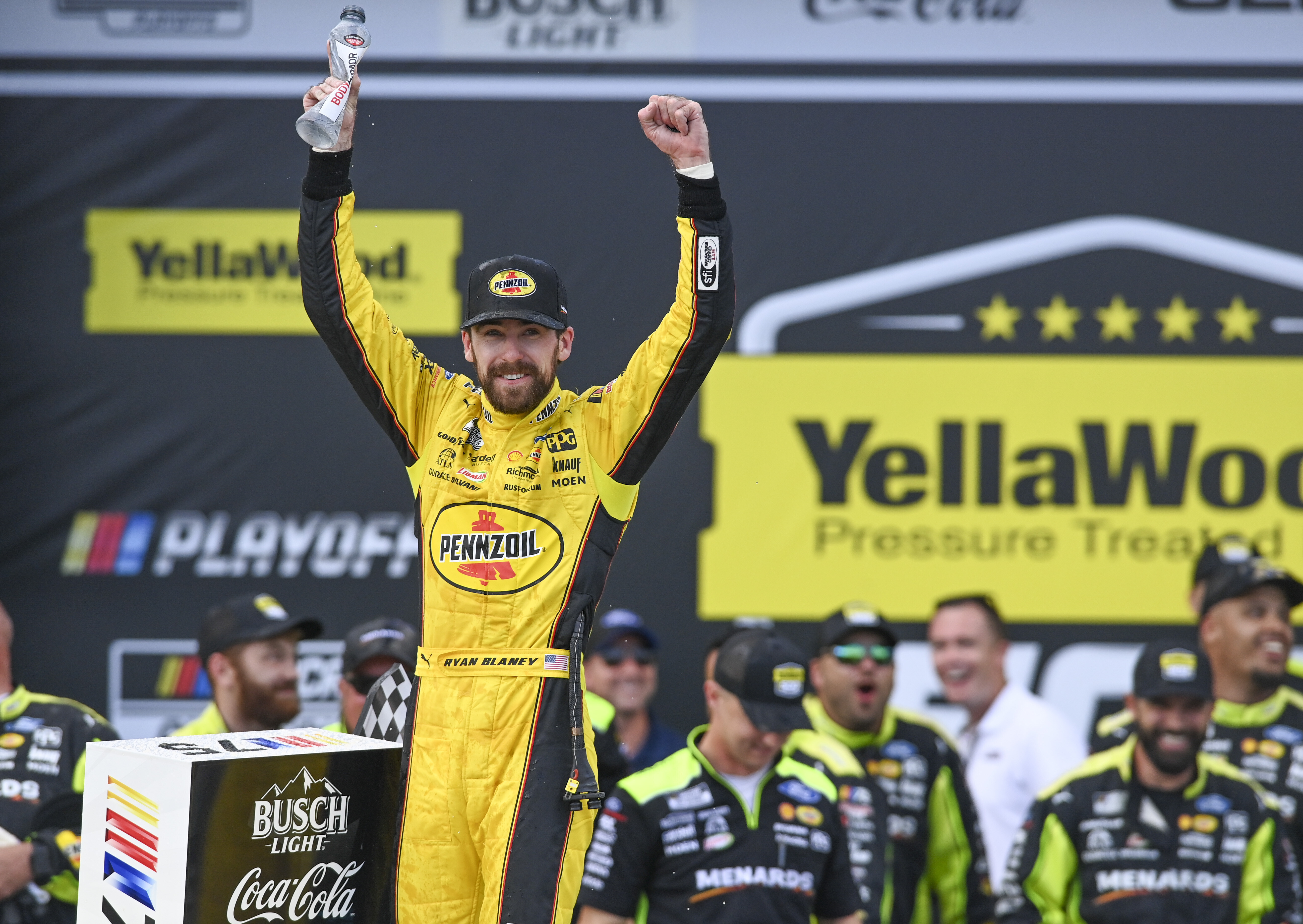 Ryan Blaney, front left, celebrates after winning a NASCAR Cup Series auto race at Talladega Superspeedway, Sunday, Oct. 1, 2023, in Talladega, Ala. 