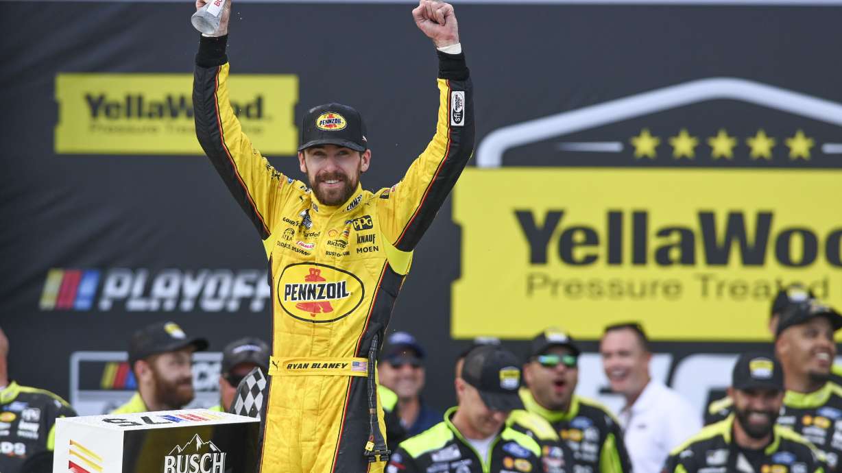 Ryan Blaney, front left, celebrates after winning a NASCAR Cup Series auto race at Talladega Superspeedway, Sunday, Oct. 1, 2023, in Talladega, Ala.