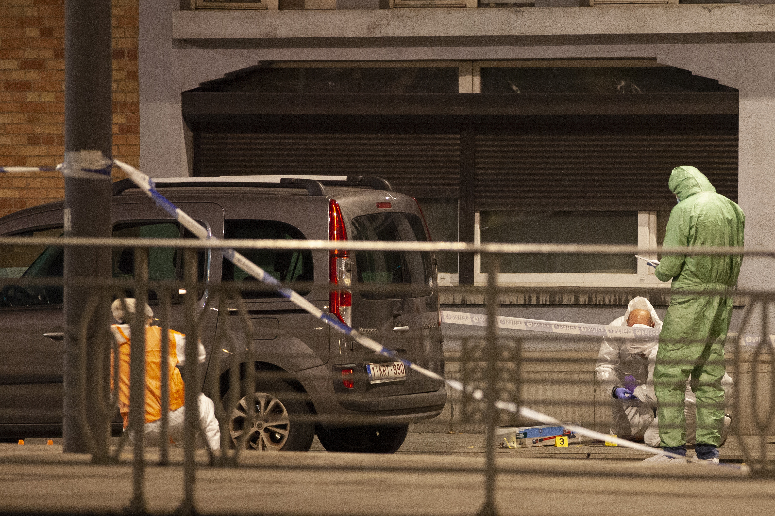 Police and inspectors work in an area where a shooting took place in the center of Brussels, Monday, Oct. 16, 2023. Belgian police say that two people are dead in central Brussels after several shots were fired. 