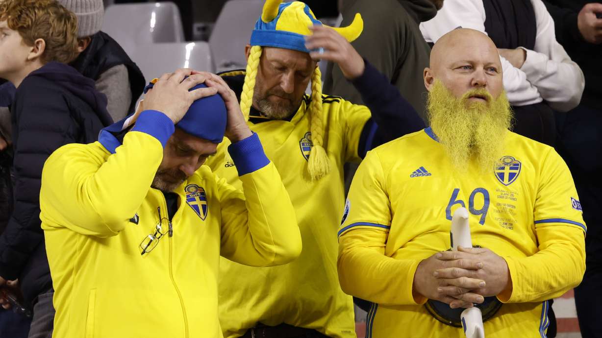 Sweden supporters wait on the stands after suspension of the Euro 2024 group F qualifying soccer match between Belgium and Sweden at the King Baudouin Stadium in Brussels, Monday, Oct. 16, 2023. The match was abandoned at halftime after two Swedes were killed in a shooting in central Brussels before kickoff.