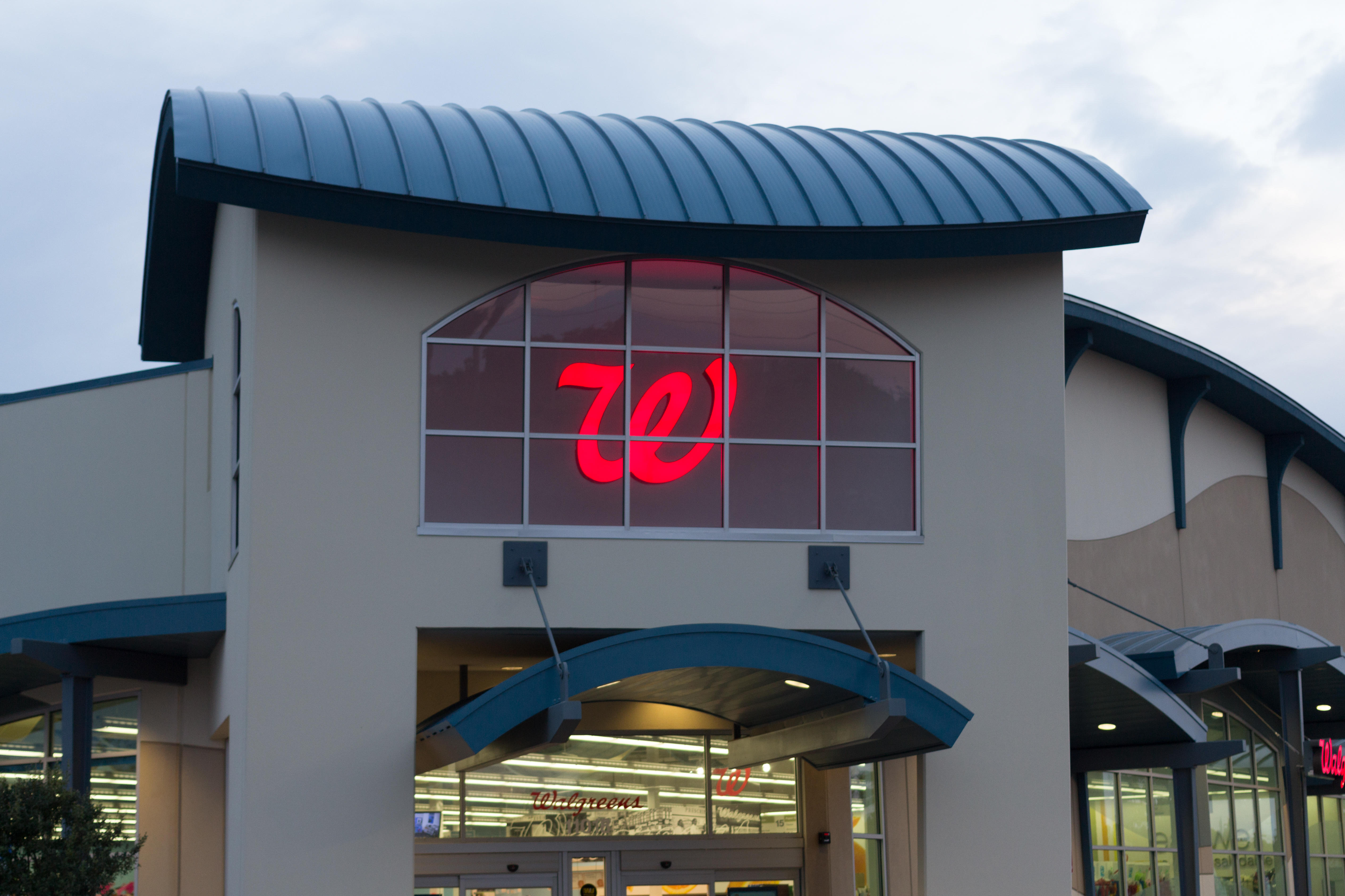 Two women were booked into jail Monday after police say they threw gasoline on a Walgreens employee once they were caught trying to shoplift in September.