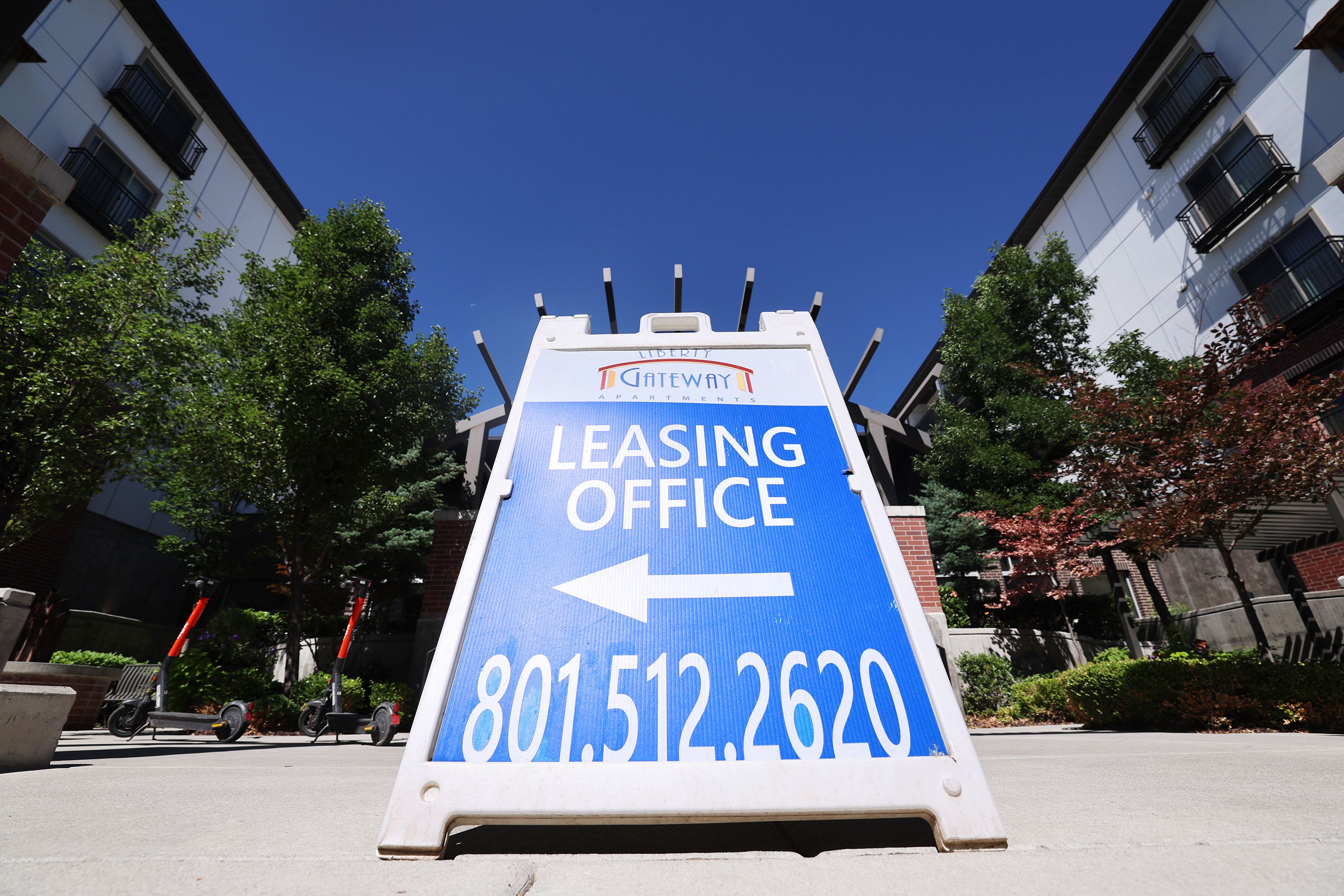Signage for the Liberty Gateway Apartments is seen in the Salt Lake Valley on July 10. States in the West are seeing some of the biggest rent declines, but prices are still high.