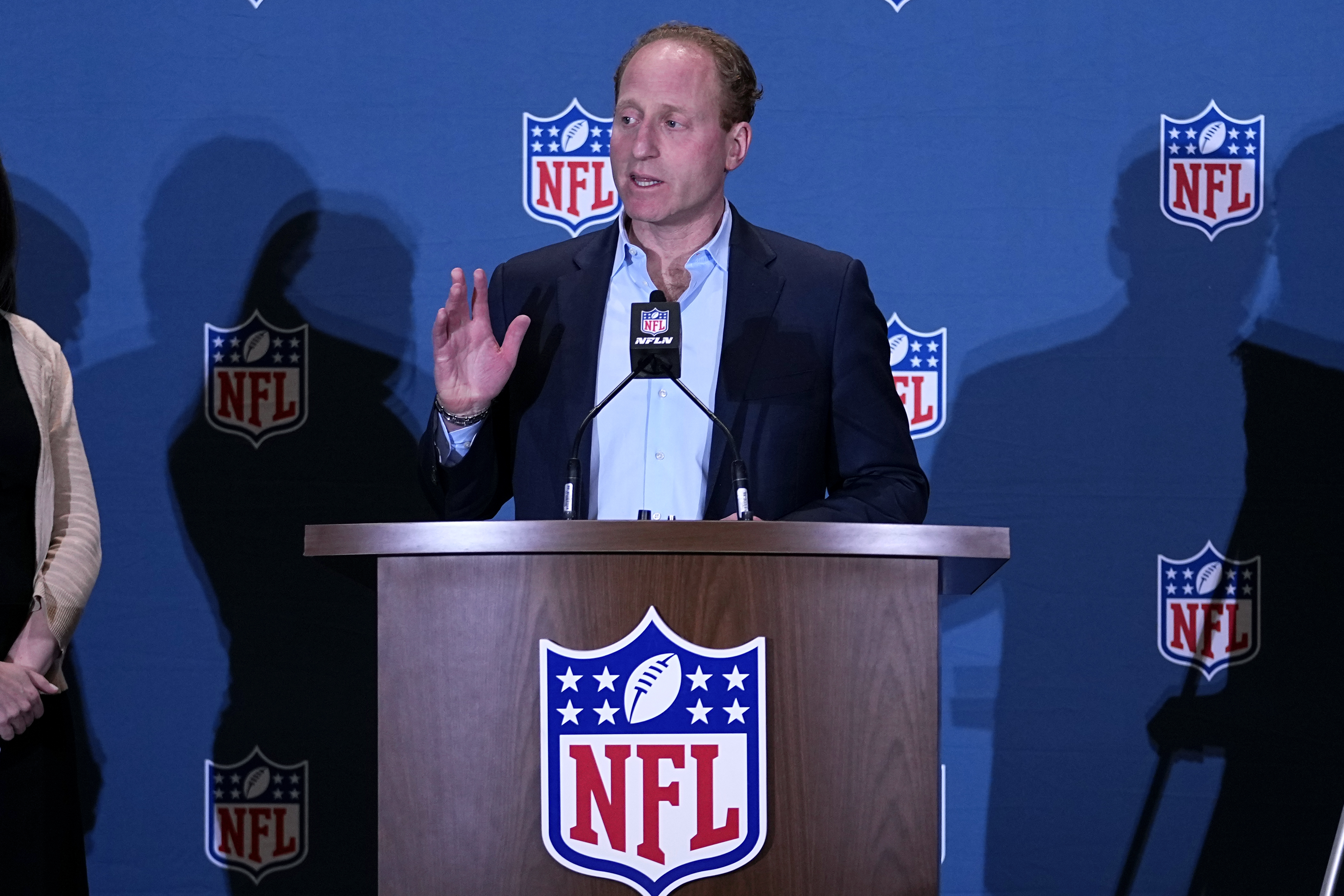 FILE -Jeff Miller, NFL Executive Vice President, Communications, Public Affairs and Policy, speaks during a news conference at the NFL football meetings, Monday, March 27, 2023, in Phoenix. The NFL is looking to eliminate the hip-drop tackle and will again discuss the "tush push" in the offseason. League executive Jeffrey Miller said Tuesday, Oct. 17, 2023 the hip-drop tackle increases risk of injury by 25 times the rate of a standard tackle.