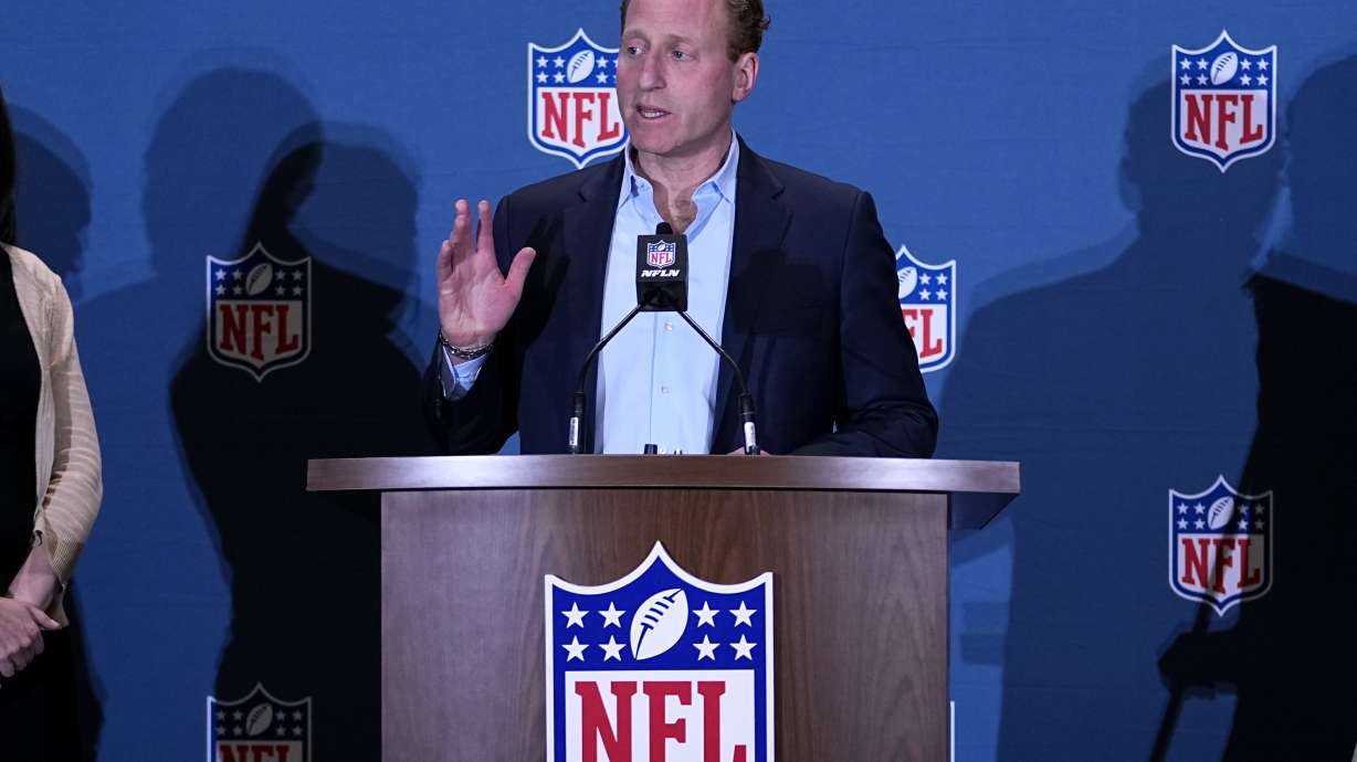 FILE -Jeff Miller, NFL Executive Vice President, Communications, Public Affairs and Policy, speaks during a news conference at the NFL football meetings, Monday, March 27, 2023, in Phoenix. The NFL is looking to eliminate the hip-drop tackle and will again discuss the "tush push" in the offseason. League executive Jeffrey Miller said Tuesday, Oct. 17, 2023 the hip-drop tackle increases risk of injury by 25 times the rate of a standard tackle.