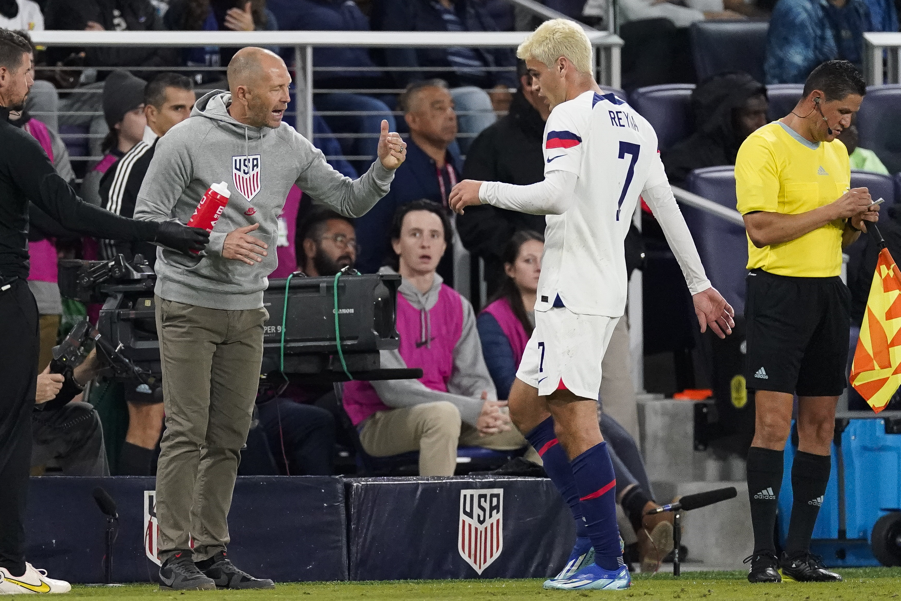United States head coach Gregg Berhalter talks with midfielder Gio Reyna (7) during the first half of an international friendly soccer match against Ghana, Tuesday, Oct. 17, 2023, in Nashville, Tenn. 