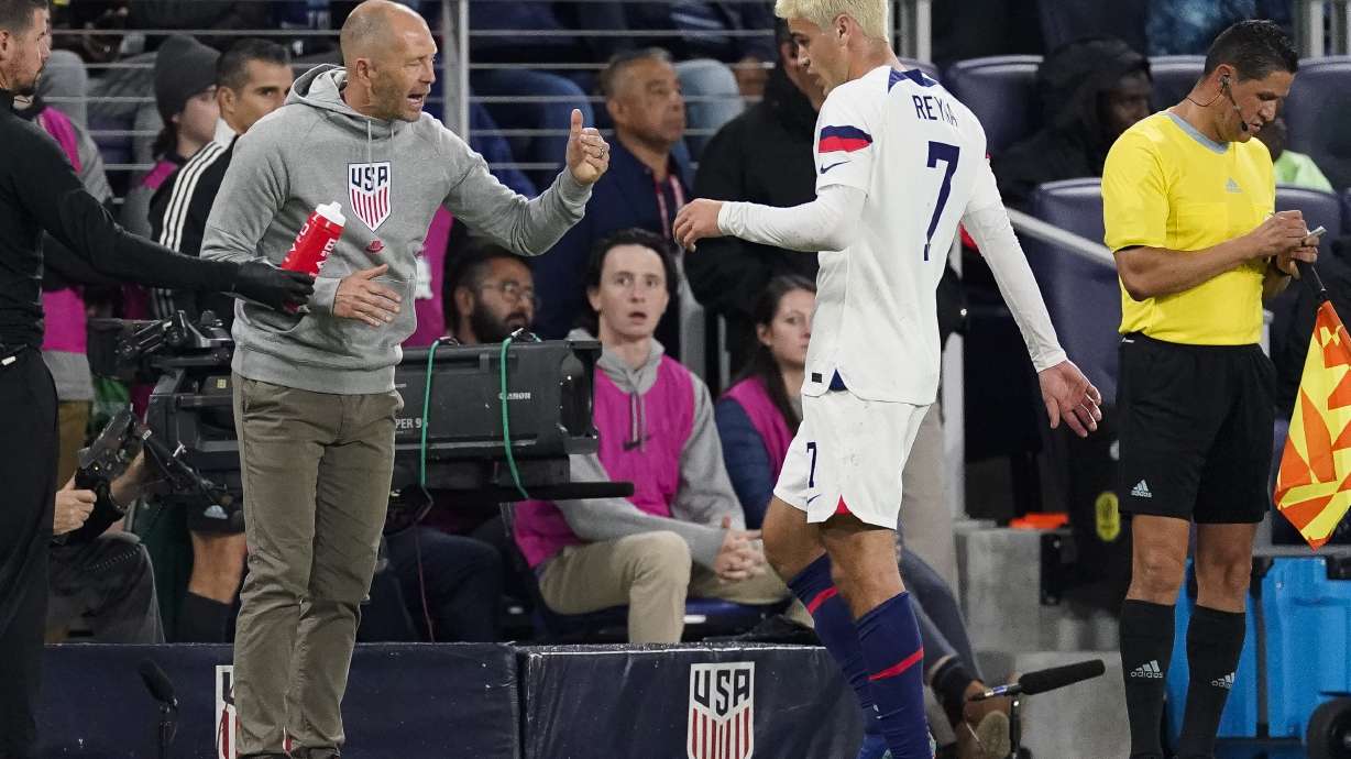 United States head coach Gregg Berhalter talks with midfielder Gio Reyna (7) during the first half of an international friendly soccer match against Ghana, Tuesday, Oct. 17, 2023, in Nashville, Tenn.