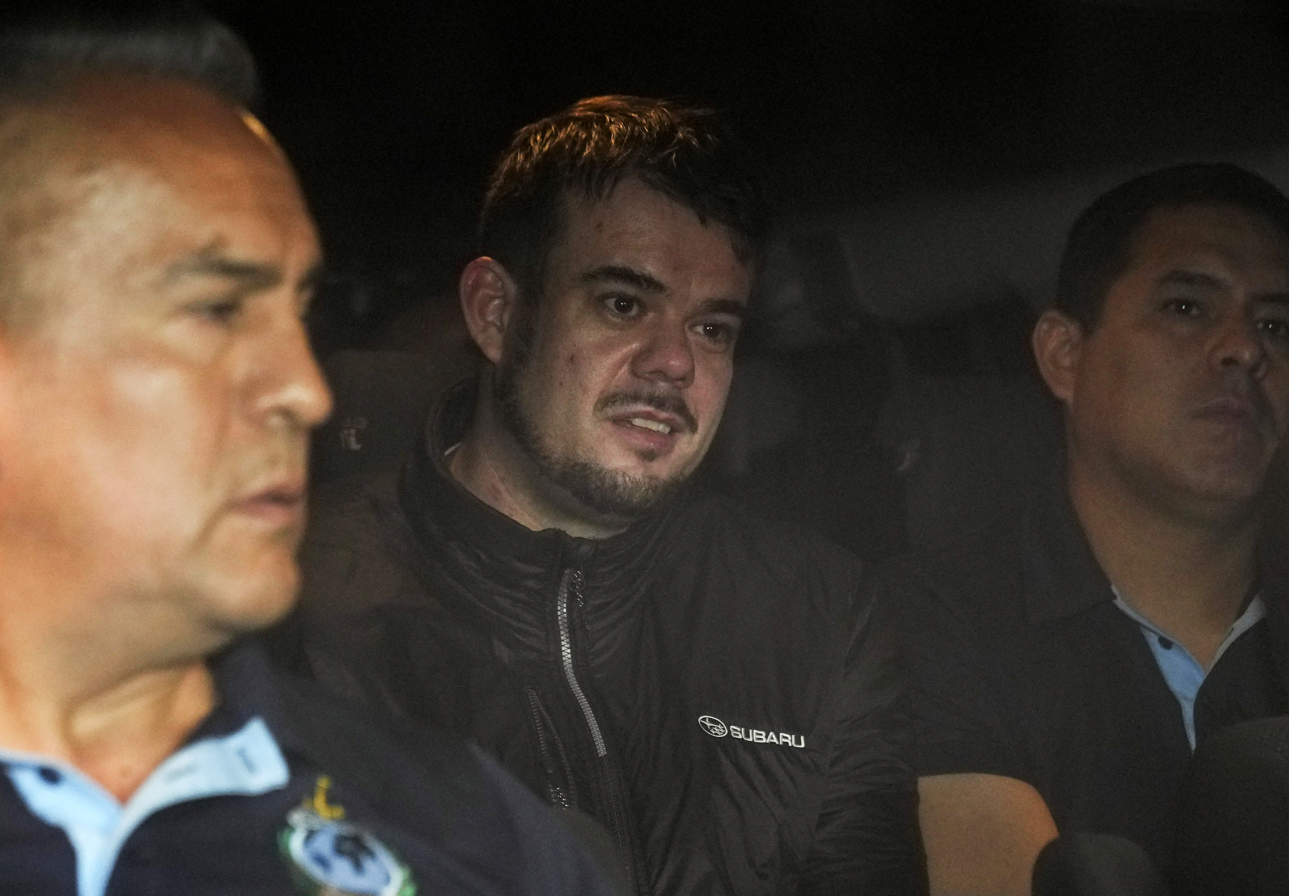 Dutch citizen Joran van der Sloot is driven in a police vehicle from a maximum-security prison to an airport to be extradited to the U.S., on the outskirts of Lima, Peru, June 8.  A judge said van der Sloot has admitted to killing Natalee Holloway.